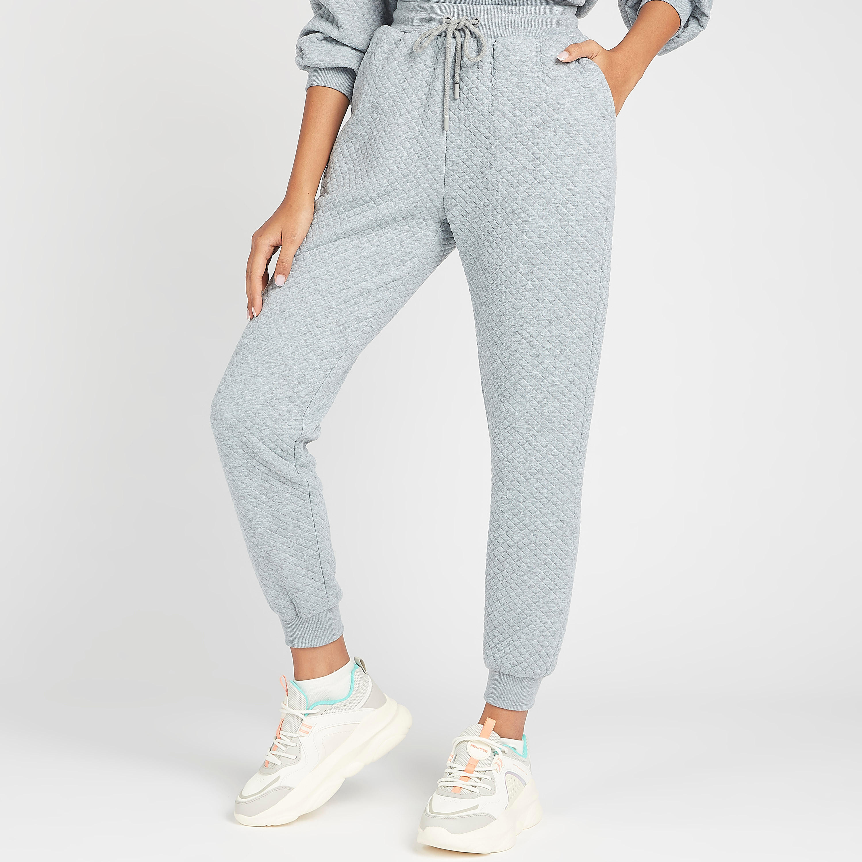 بنطلون رياضي مبطن بخصر متوسط الارتفاع وجيوب ورباط إغلاق-women-clothing-bottoms-joggers-image-1