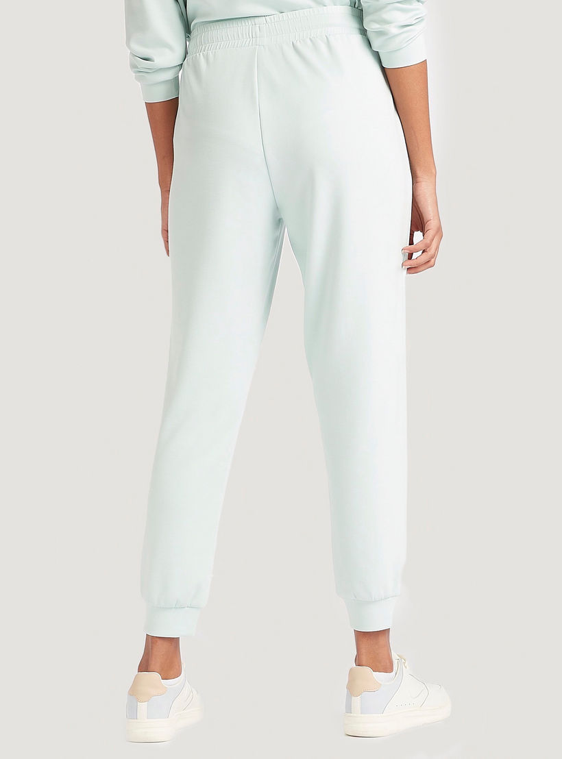 بنطلون رياضي سادة متوسط الارتفاع بجيوب ورباط إغلاق-women-clothing-bottoms-joggers-image-3