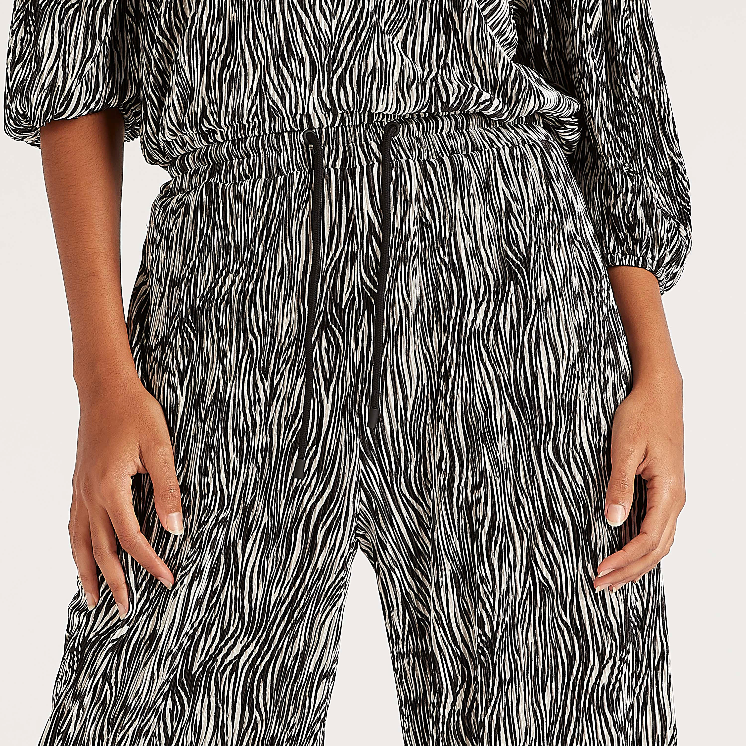 بنطلون بطبعات حيوانات وخصر مطّاطي متوسّط الارتفاع وجيوب-women-clothing-bottoms-trousers-image-3