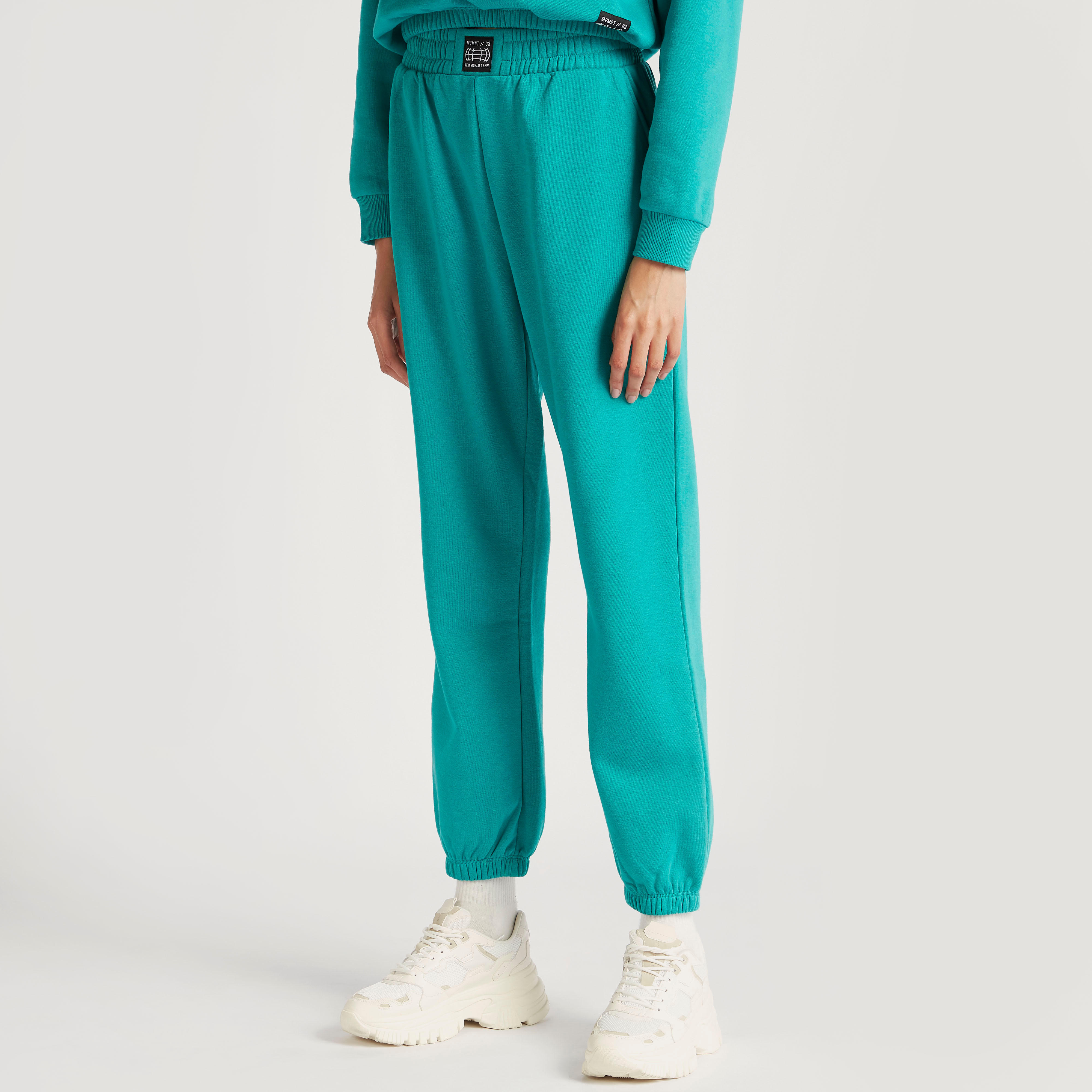 بنطلون رياضي سادة بخصر مطاطي مرتفع وجيوب-women-clothing-bottoms-joggers-image-5