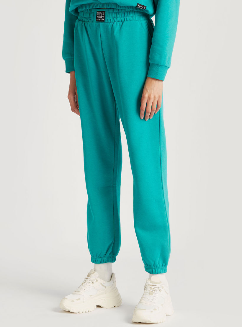 بنطلون رياضي سادة بخصر مطاطي مرتفع وجيوب-women-clothing-bottoms-joggers-image-5