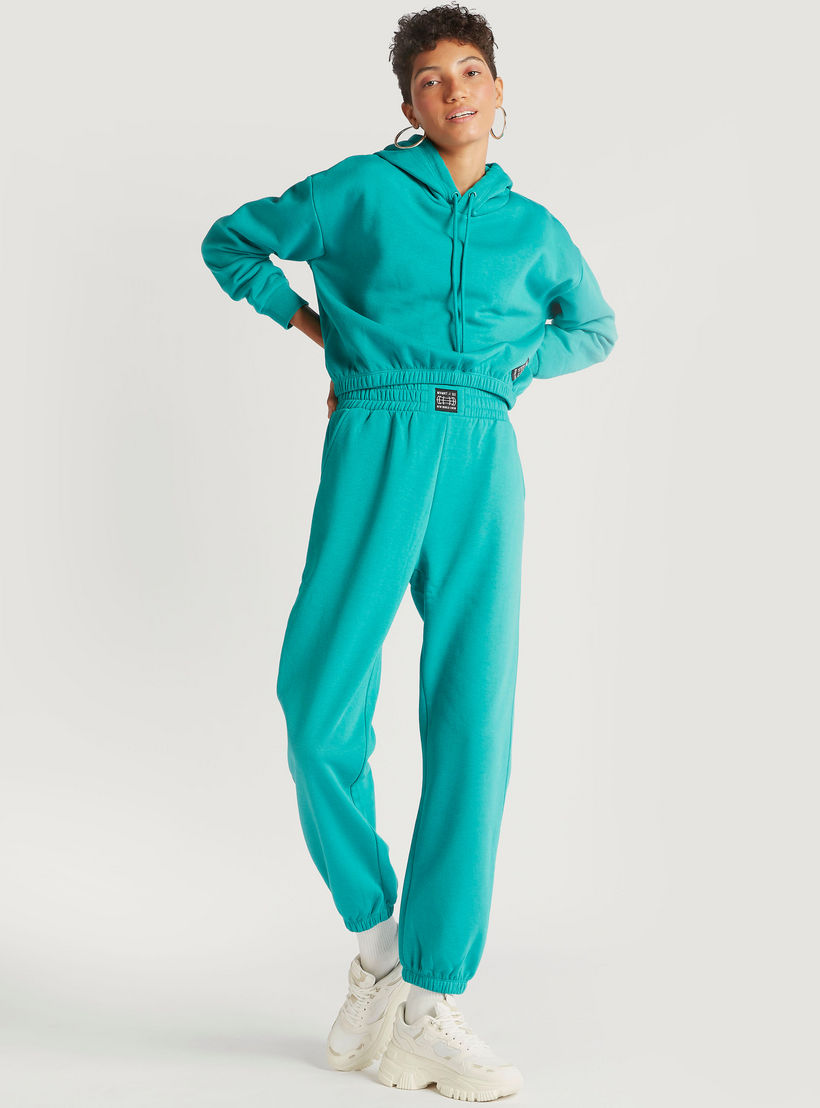 بنطلون رياضي سادة بخصر مطاطي مرتفع وجيوب-women-clothing-bottoms-joggers-image-4