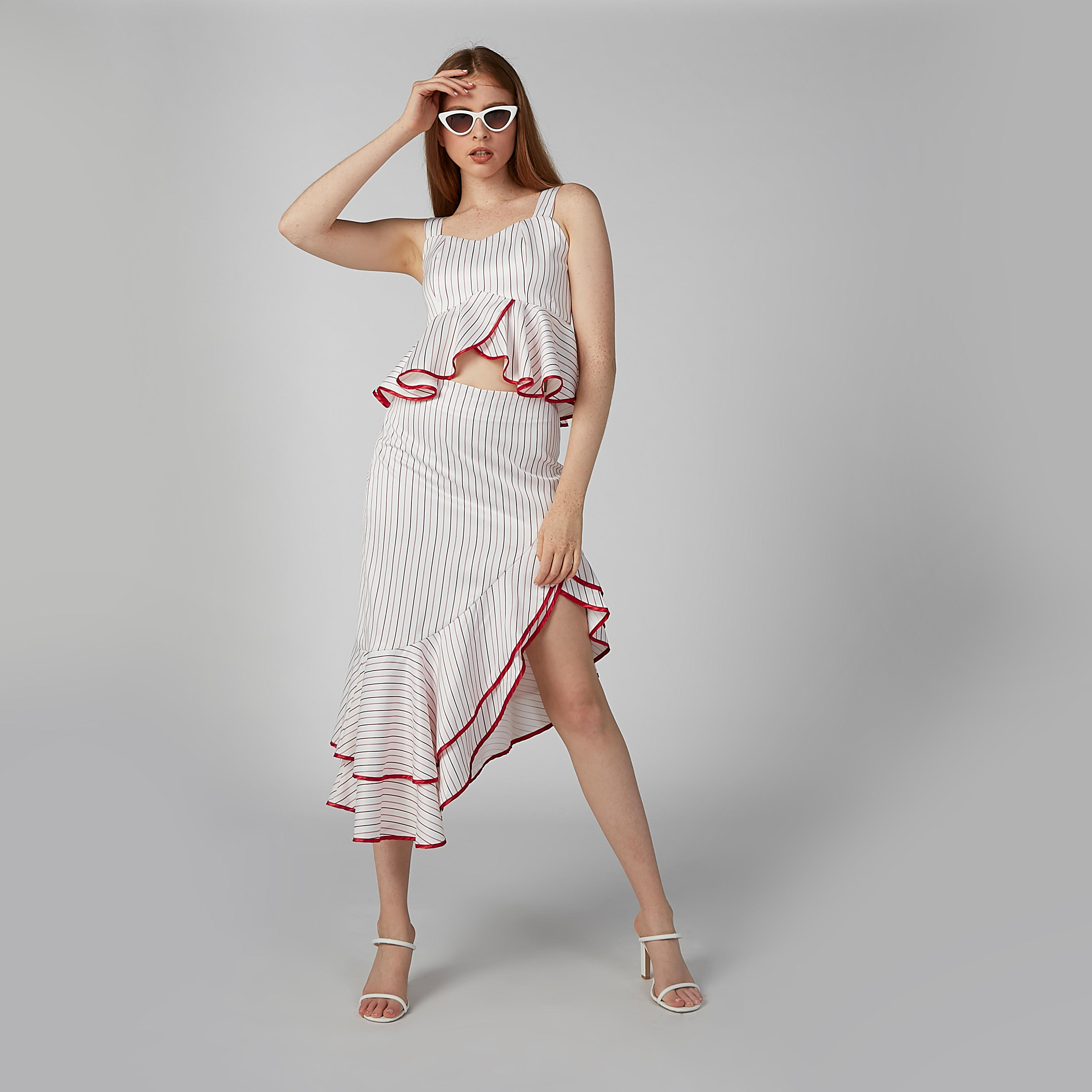 تنورة مقلّمة بحوّاف غير مستوية وتفاصيل كشكش من آيل-women-clothing-bottoms-skirts-image-1
