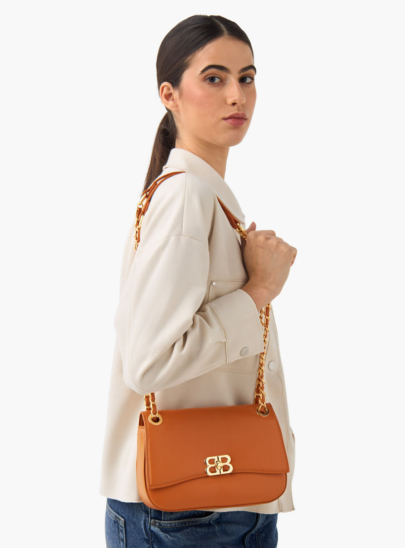 شنطة كروس بودي سادة بقفل تويست من أدور-women-bagsandwallets-handbags-image-8