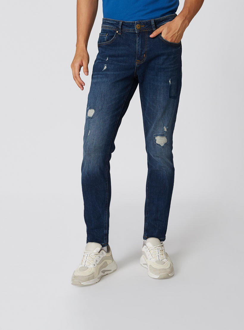 بنطلون جينز ممزّق بقصّة سليم وخصر متوسط الارتفاع وجيوب من آيكونيك-men-clothing-bottoms-jeans-image-1