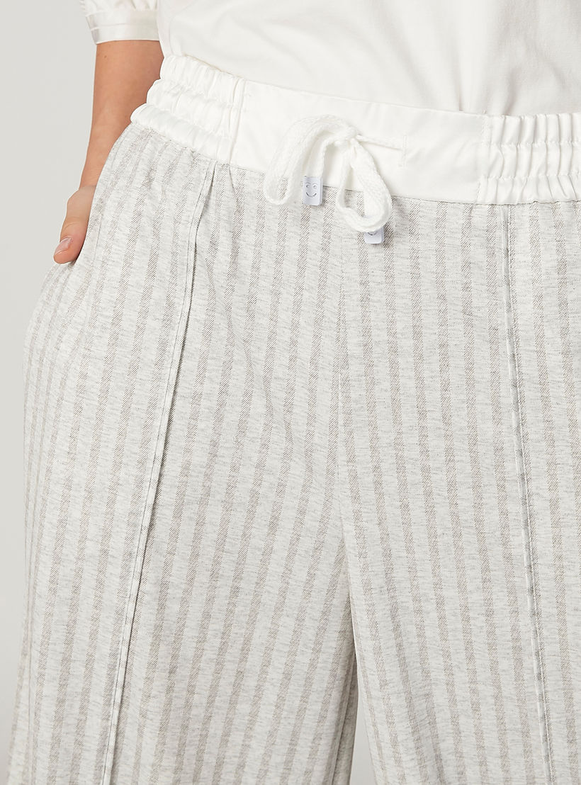 بنطلون مخطط بقصّة واسعة وخصر متوسط الارتفاع وجيوب من آيكونيك-women-clothing-bottoms-trousers-image-3