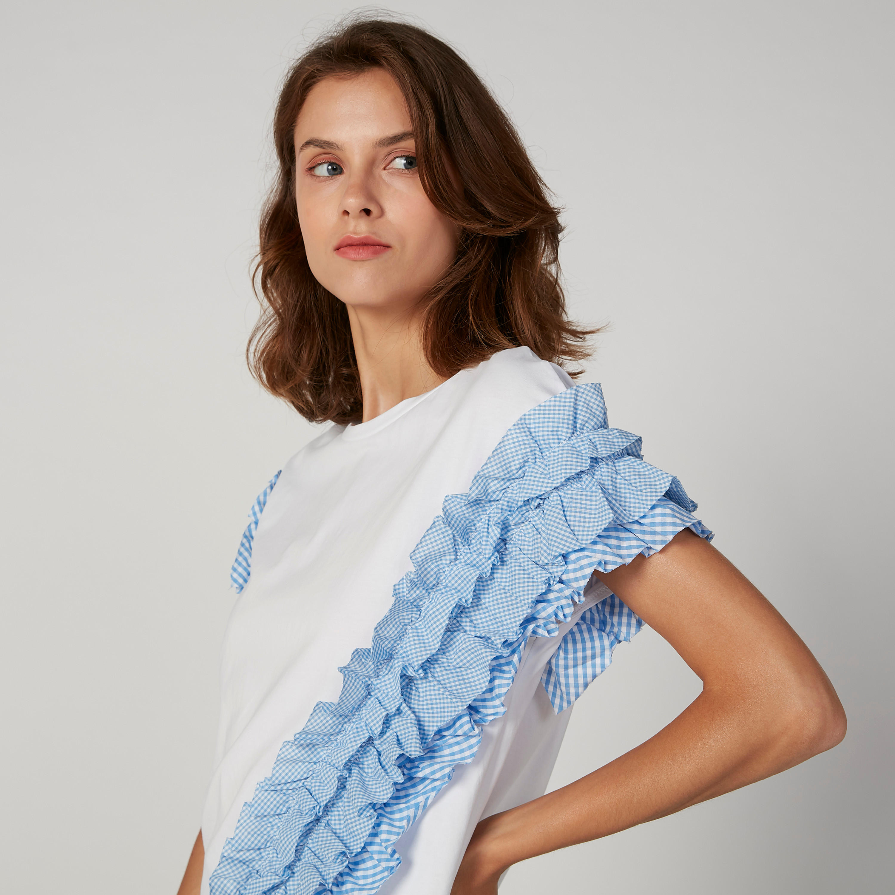 بلوزة سكيني كاروهات بياقة مستديرة وتفاصيل كشكش من آيكونيك-women-clothing-tshirts-image-3
