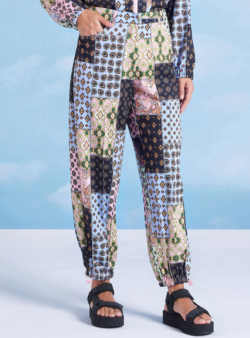 بنطلون رياضي بقصّة واسعة وخصر متوسط الارتفاع وجيوب من آيكونيك-women-clothing-bottoms-joggers-image-1