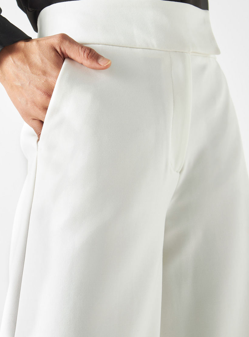 بنطلون سادة واسع الساقين بجيوب من آيكونك-women-clothing-bottoms-trousers-image-1