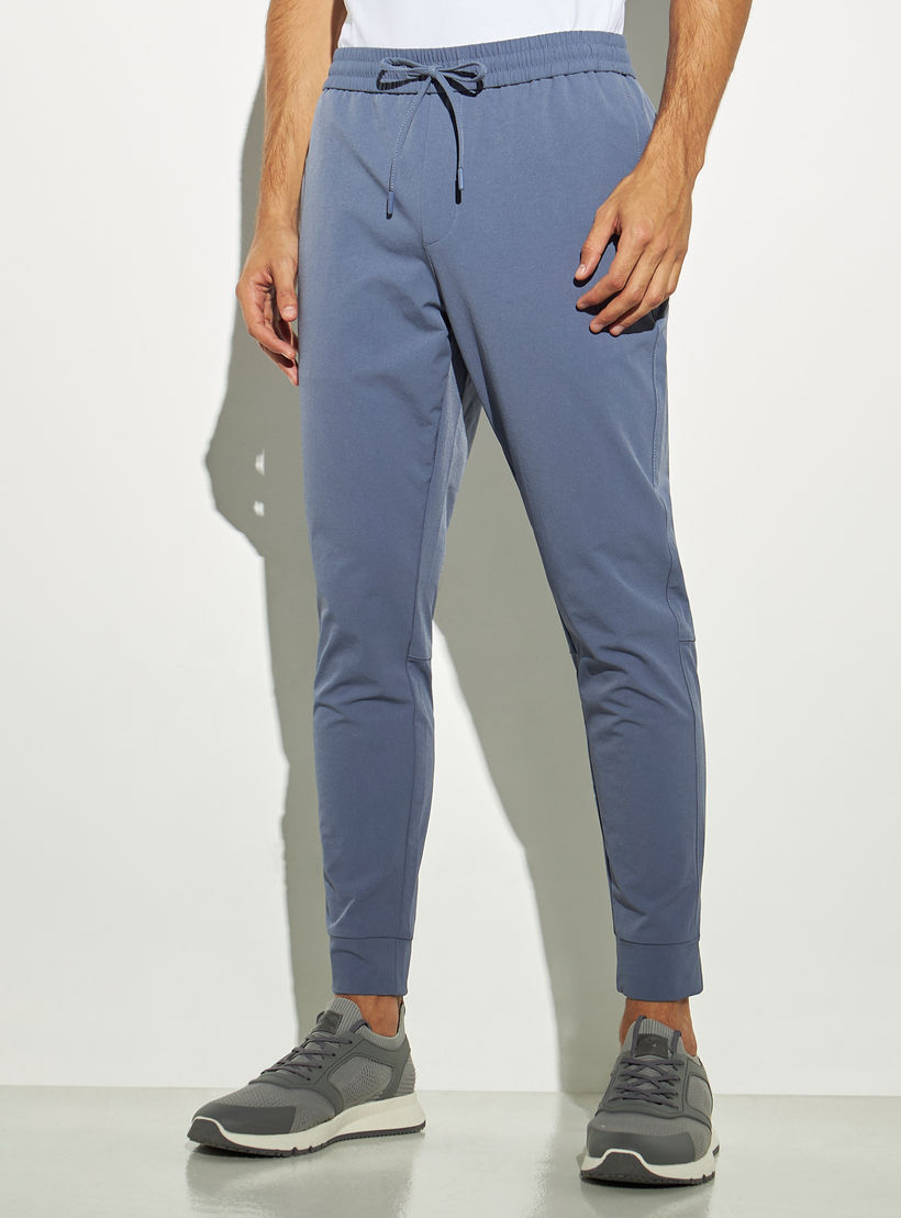 بنطلون رياضي سادة برباط إغلاق وجيوب بسحاب من آيكونيك-men-clothing-bottoms-joggers-image-4