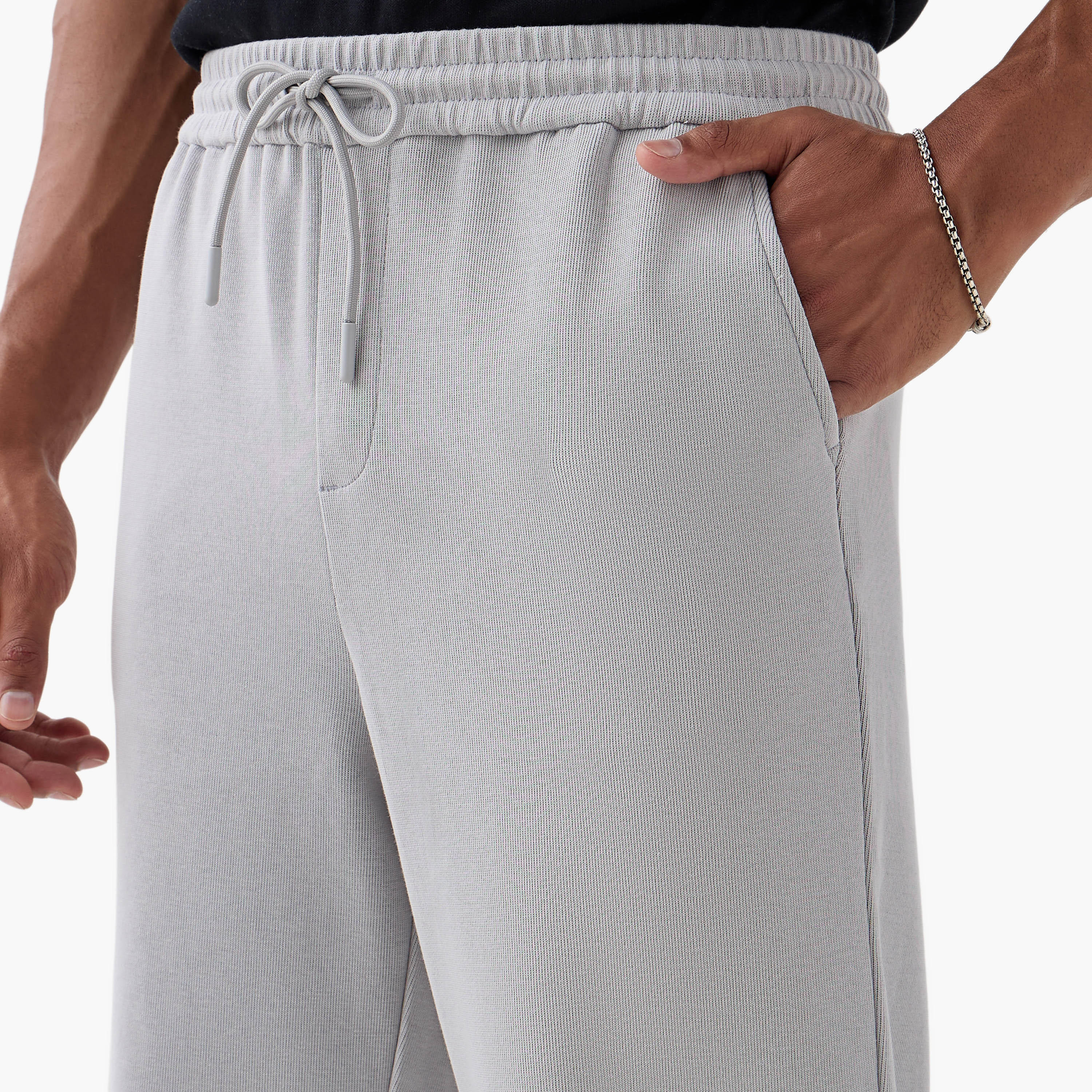 بنطلون بقصة ضيقة وخصر مرن وجيوب من آيكونيك-men-clothing-bottoms-trousersandchinos-trousers-image-4