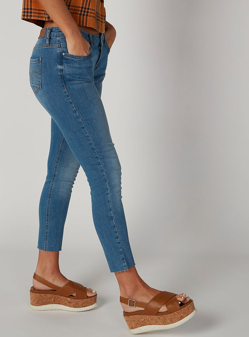 بنطلون جينز مستدام سكيني ممزّق بخصر متوسط الارتفاع وجيوب-women-clothing-bottoms-jeans-image-3