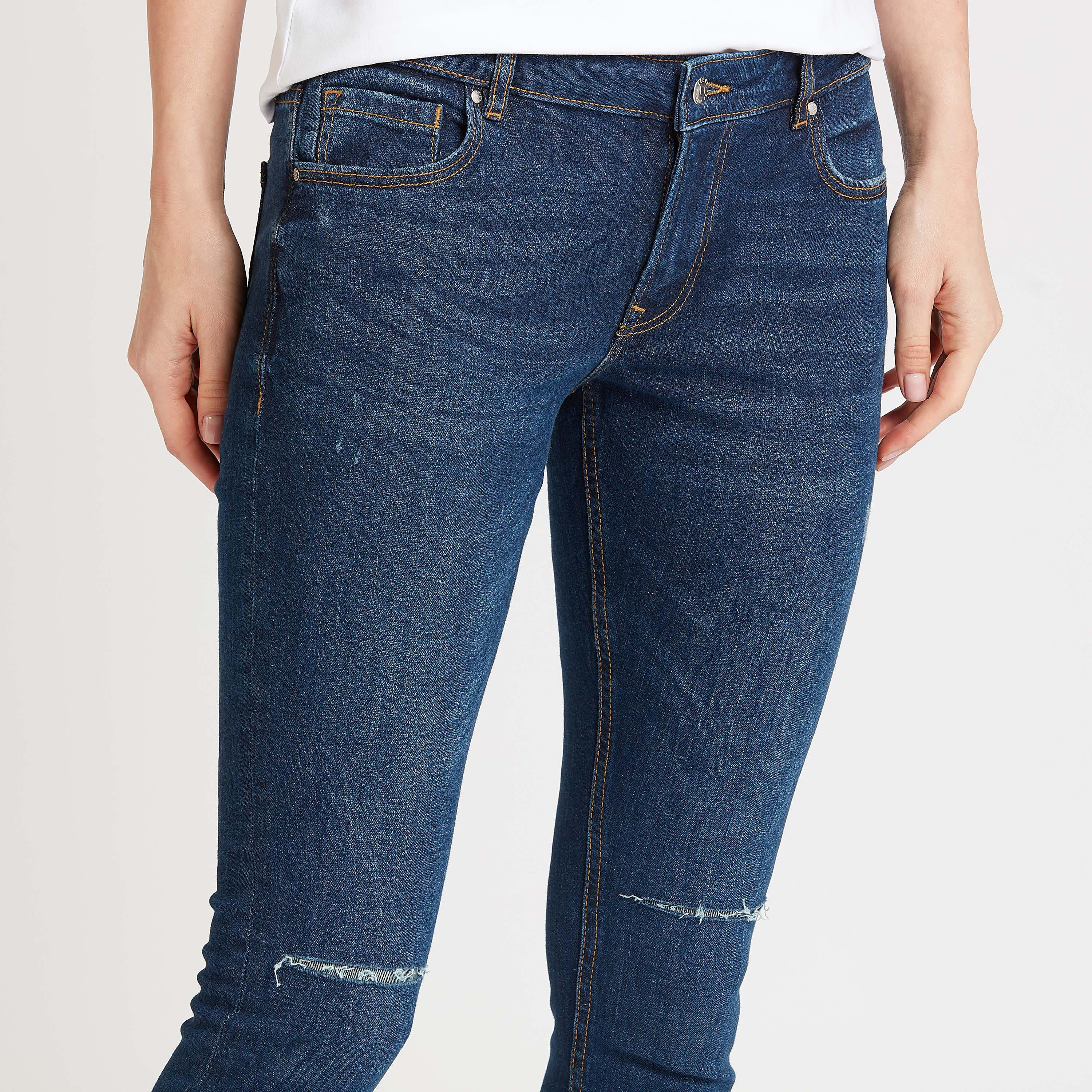 بنطلون جينز سكيني ممزّق بخصر متوسط الارتفاع وتفاصيل جيوب من لي كوبر-women-clothing-bottoms-jeans-image-3