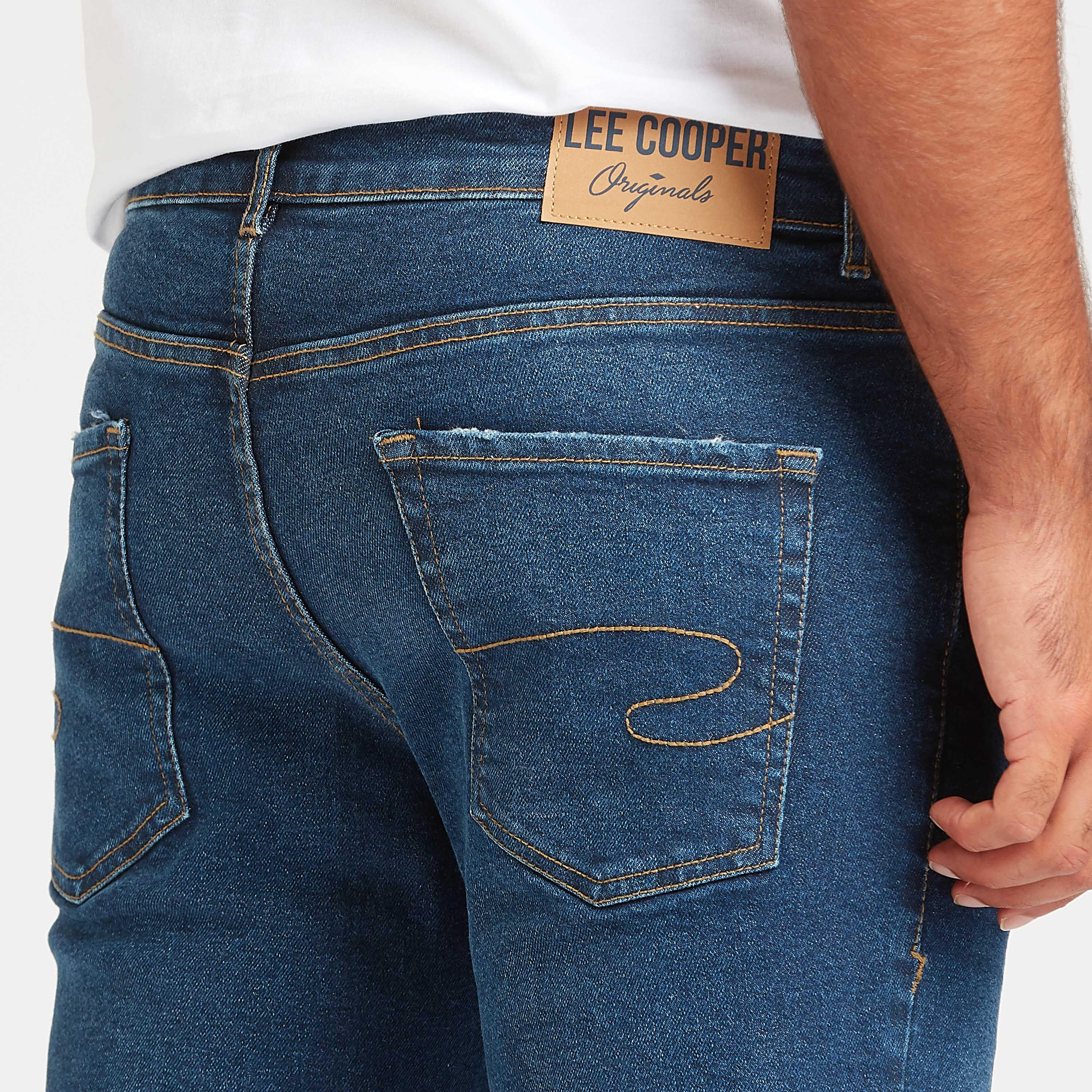 بنطلون جينز سليم فيت ممزق بخصر متوسط الإرتفاع وتفاصيل جيوب من لي كوبر-men-clothing-bottoms-jeans-image-5