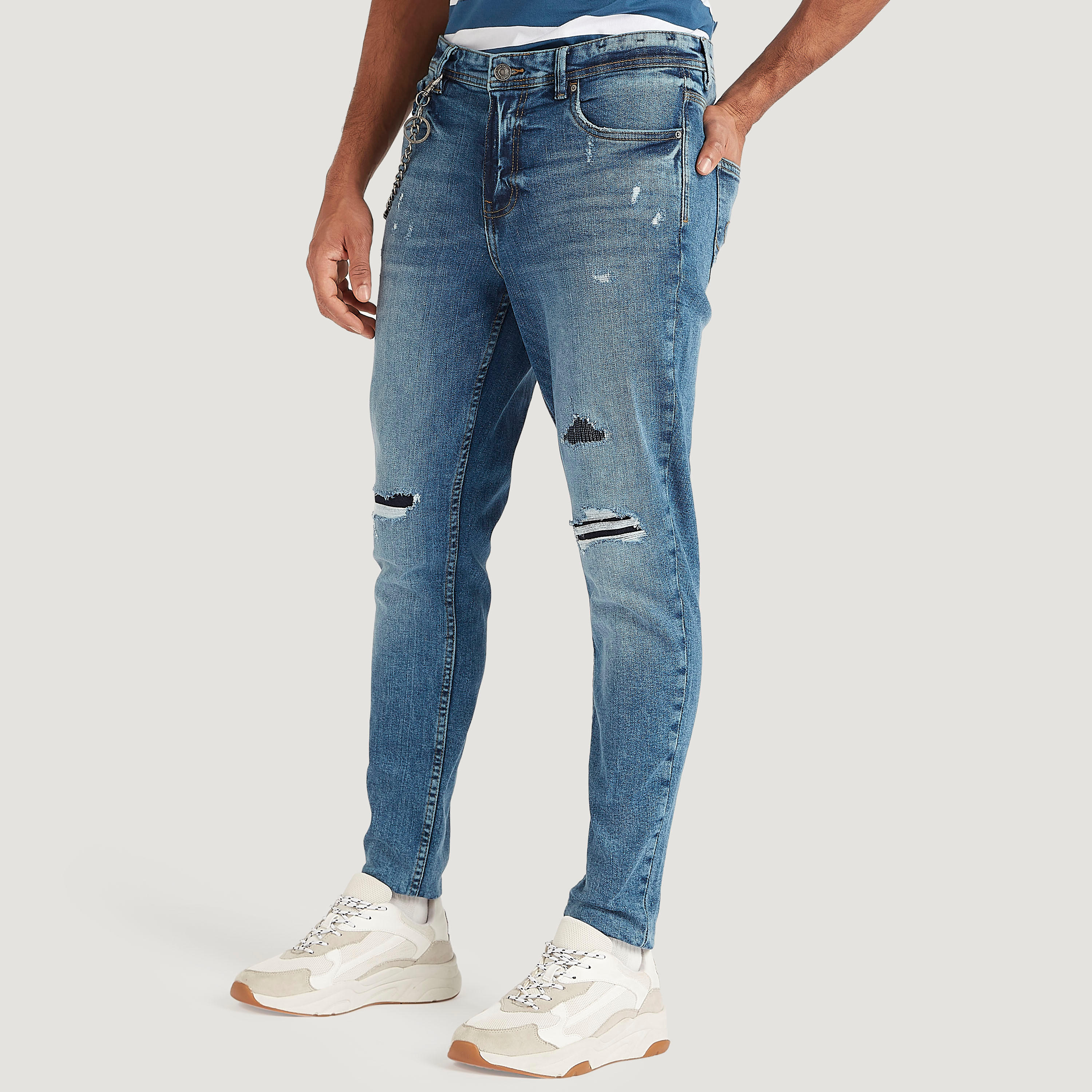 بنطلون جينز مضلّع كاروت فيت بخصر منخفض من لي كوبر-men-clothing-bottoms-jeans-image-1
