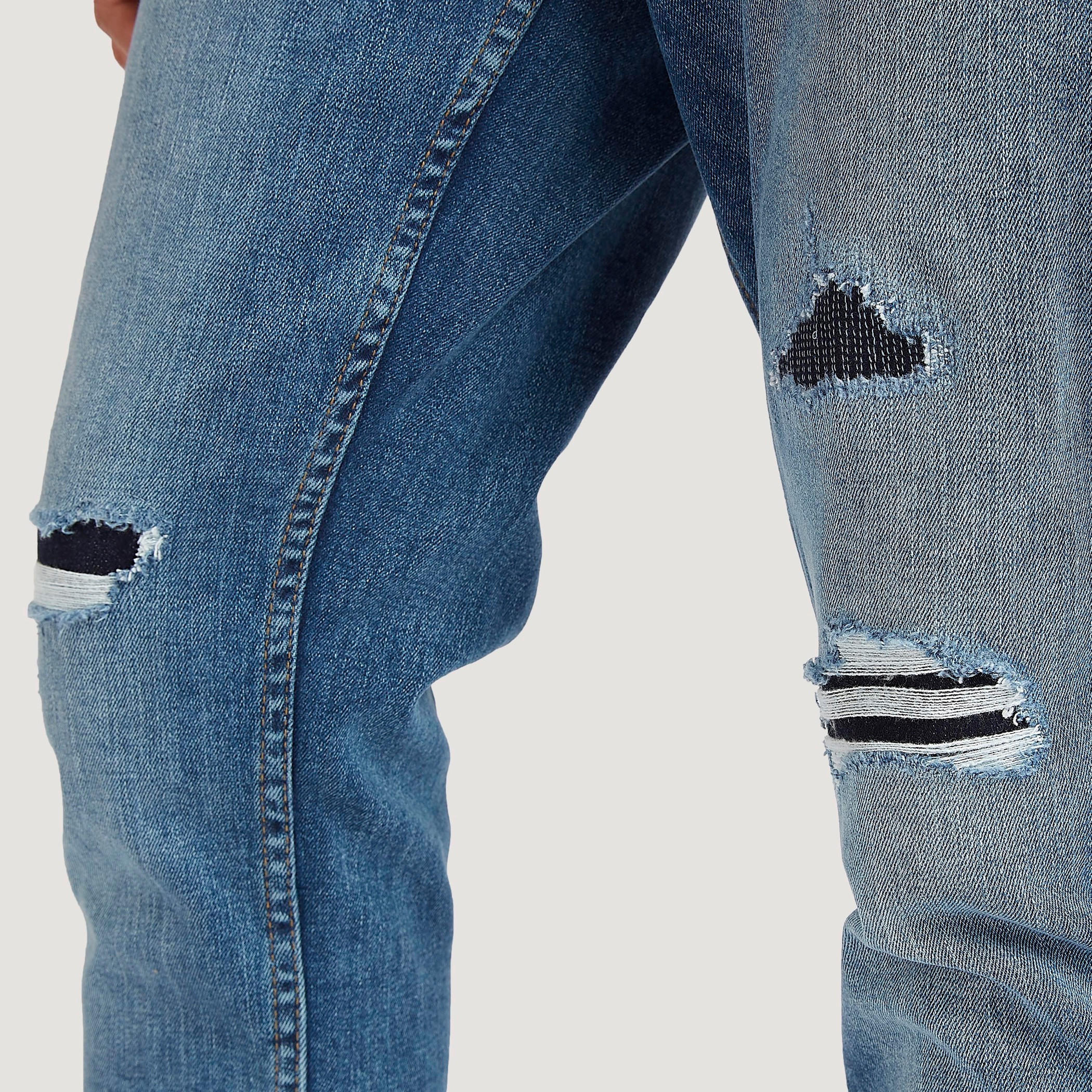بنطلون جينز مضلّع كاروت فيت بخصر منخفض من لي كوبر-men-clothing-bottoms-jeans-image-6