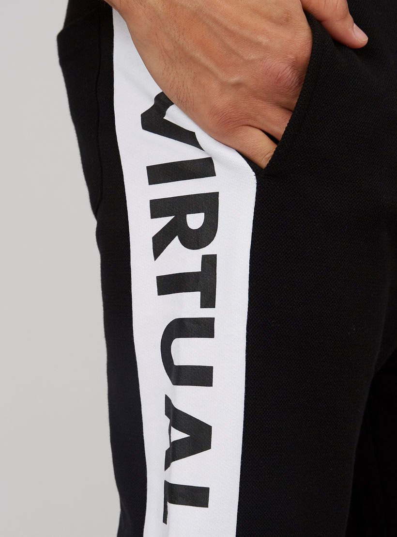 بنطلون رياضي بخصر مطّاطي وشريطة وطبعات-men-clothing-bottoms-joggers-image-4