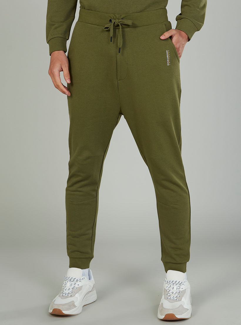 بنطلون رياضي سكيني بخصر متوسط الارتفاع وجيوب-men-clothing-bottoms-joggers-image-1