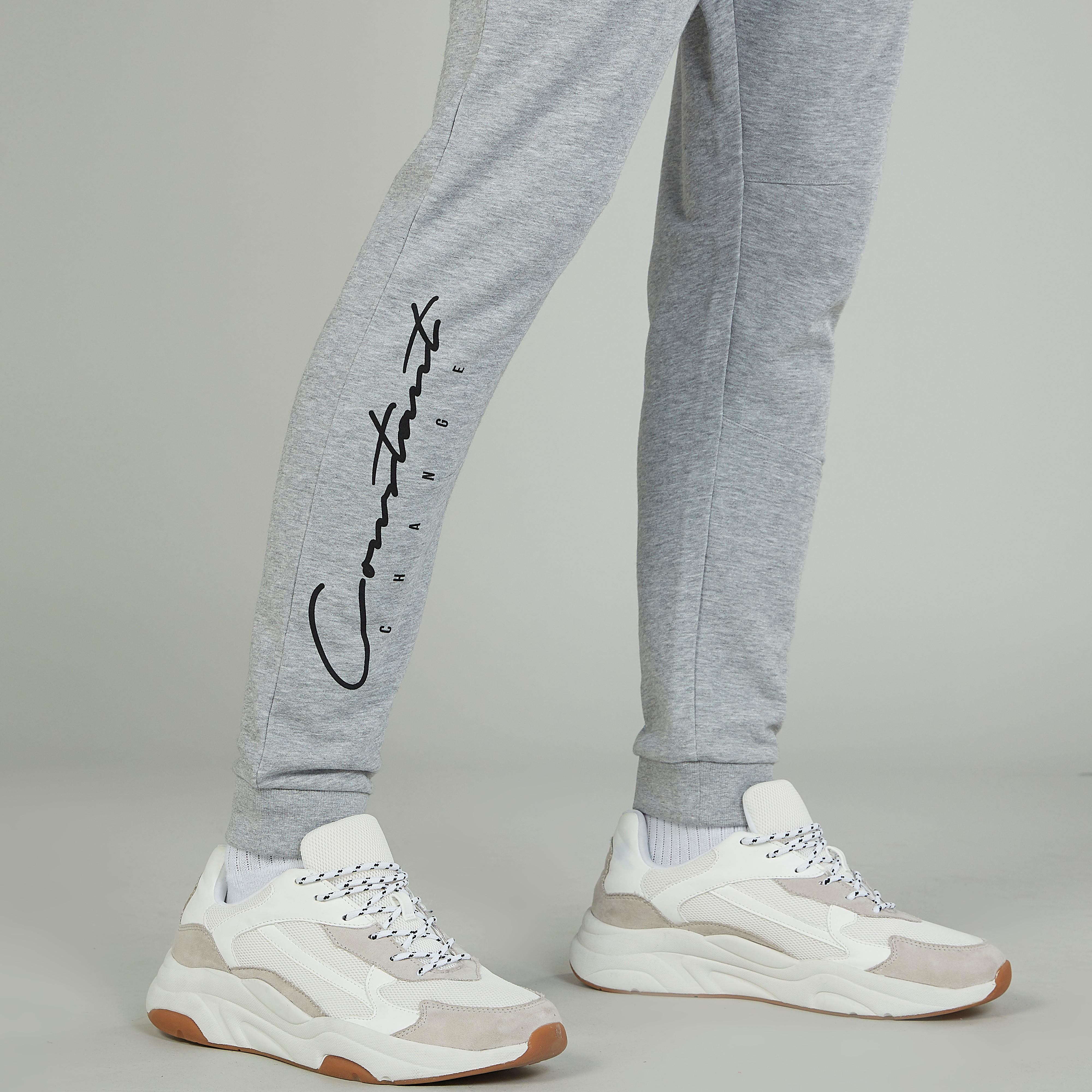 بنطلون رياضي سكيني بخصر متوسط الارتفاع وجيوب وطبعات-men-clothing-bottoms-joggers-image-3
