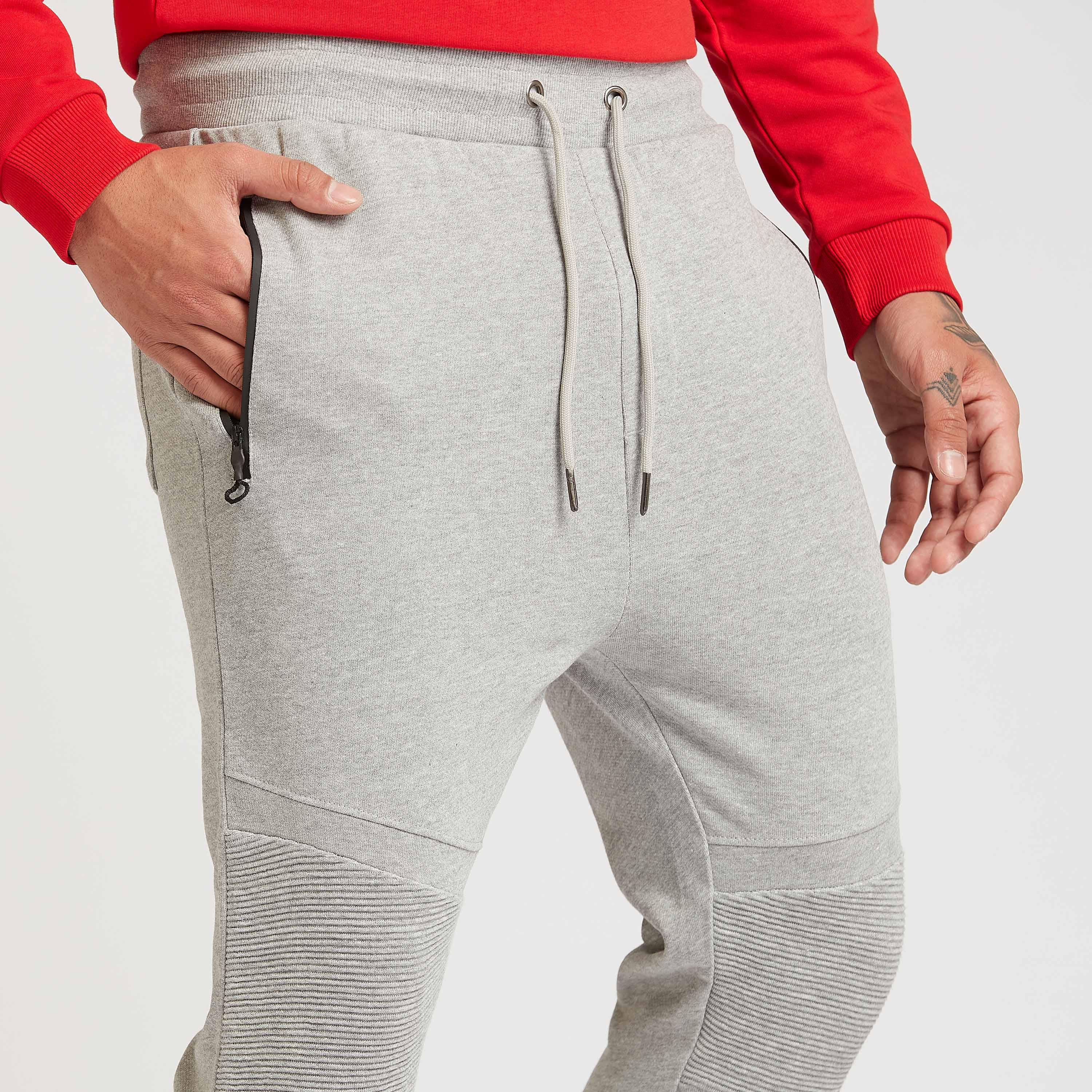 بنطلون رياضي بارز الملمس بخصر متوسط الارتفاع بقصّة سليم وجيوب ورباط-men-clothing-bottoms-joggers-image-3