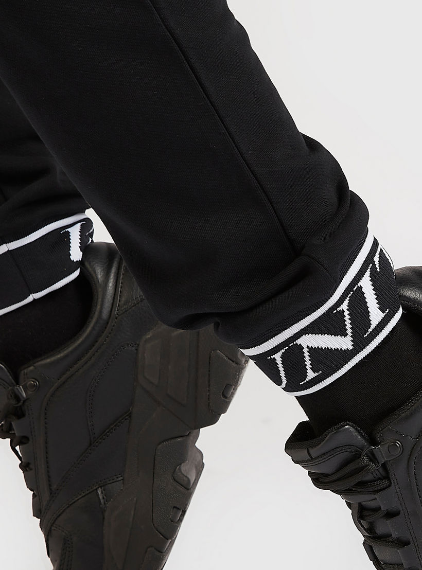 بنطلون رياضي بخصر مطّاطي متوسّط الارتفاع وطبعات-men-clothing-bottoms-joggers-image-1