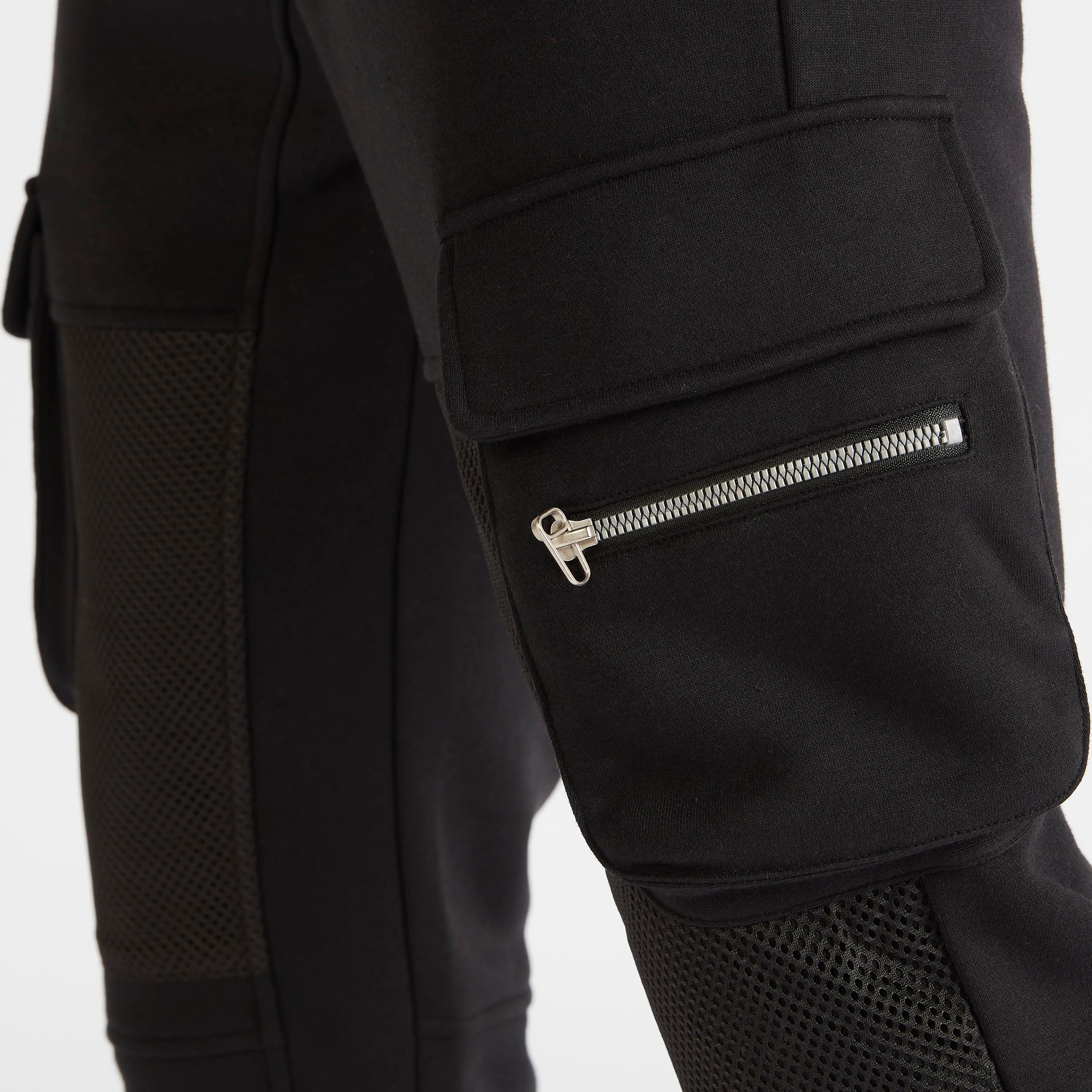 بنطلون رياضي سادة بقصّة مريحة وخصر متوسّط الارتفاع وتفاصيل شبكيّة-men-clothing-bottoms-joggers-image-3