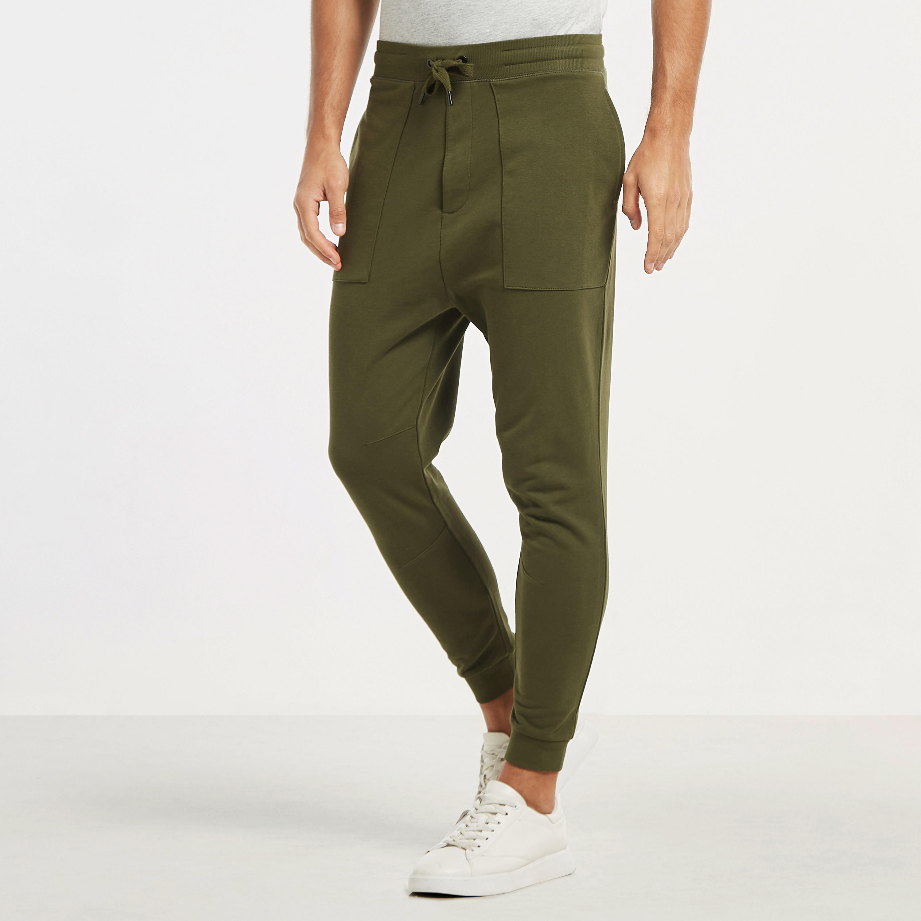 بنطلون رياضي سادة بخصر مطاطي وجيوب فضفاض-men-clothing-bottoms-joggers-image-9