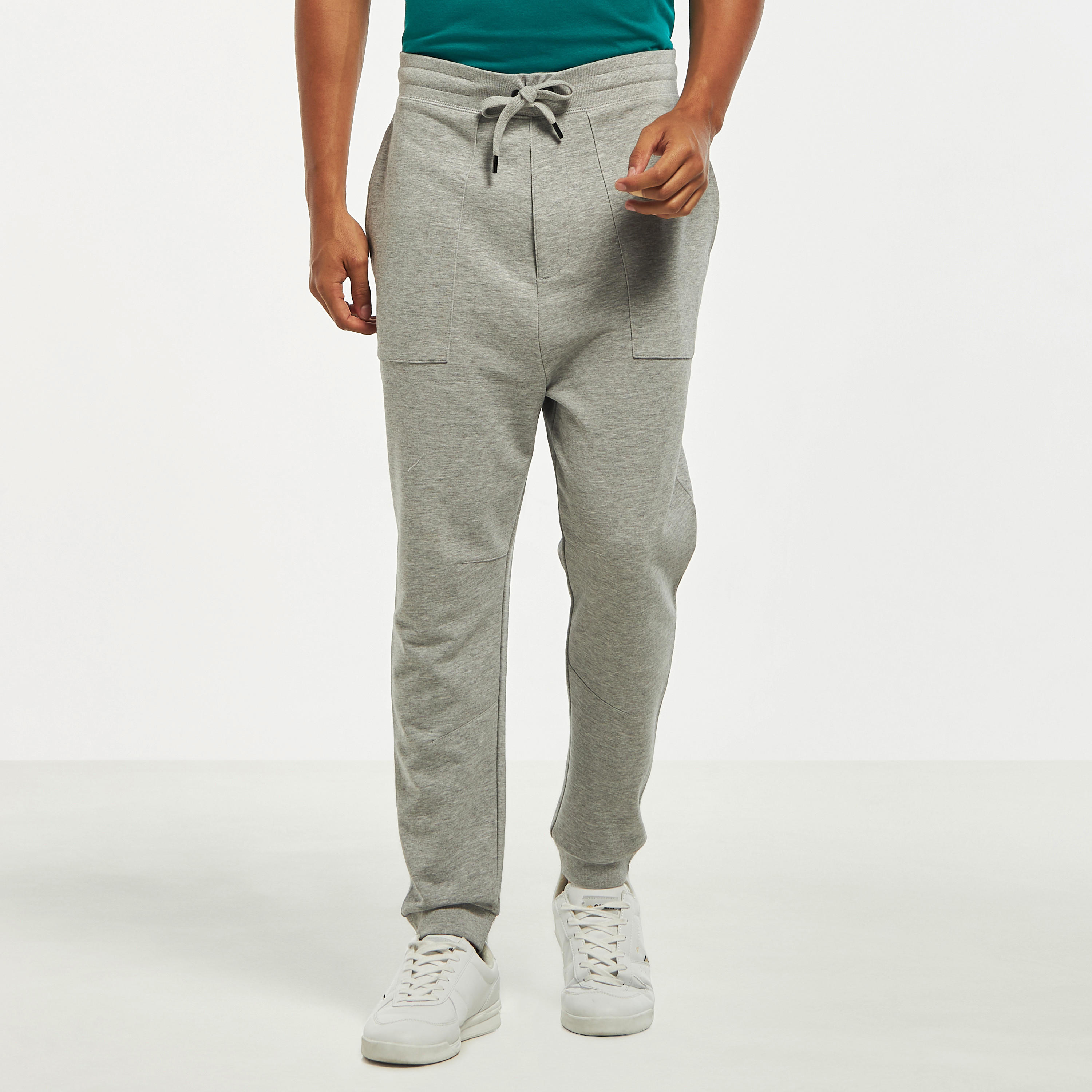 بنطلون رياضي سادة بخصر مطاطي وجيوب فضفاض-men-clothing-bottoms-joggers-image-1