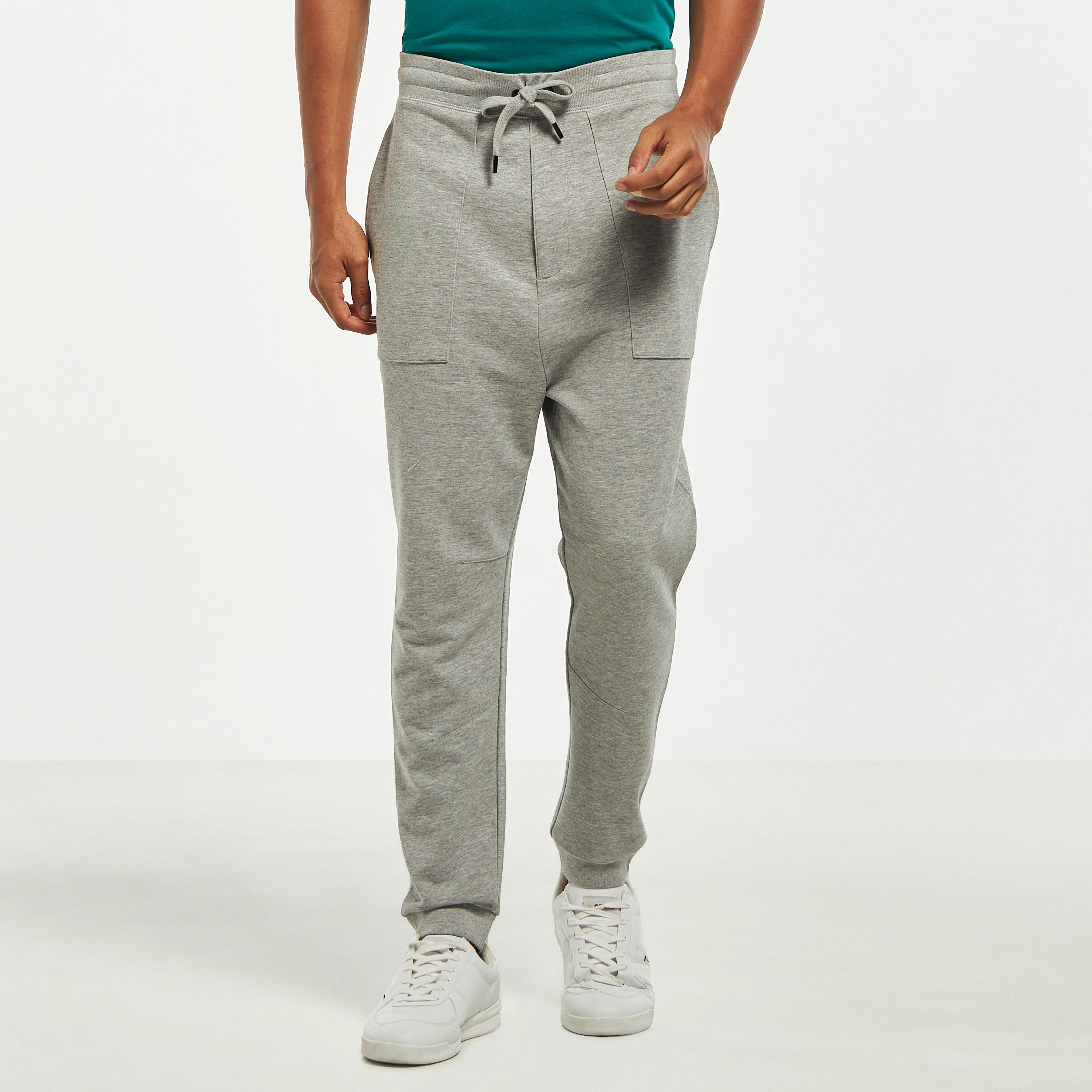 بنطلون رياضي سادة بخصر مطاطي وجيوب فضفاض-men-clothing-bottoms-joggers-image-1
