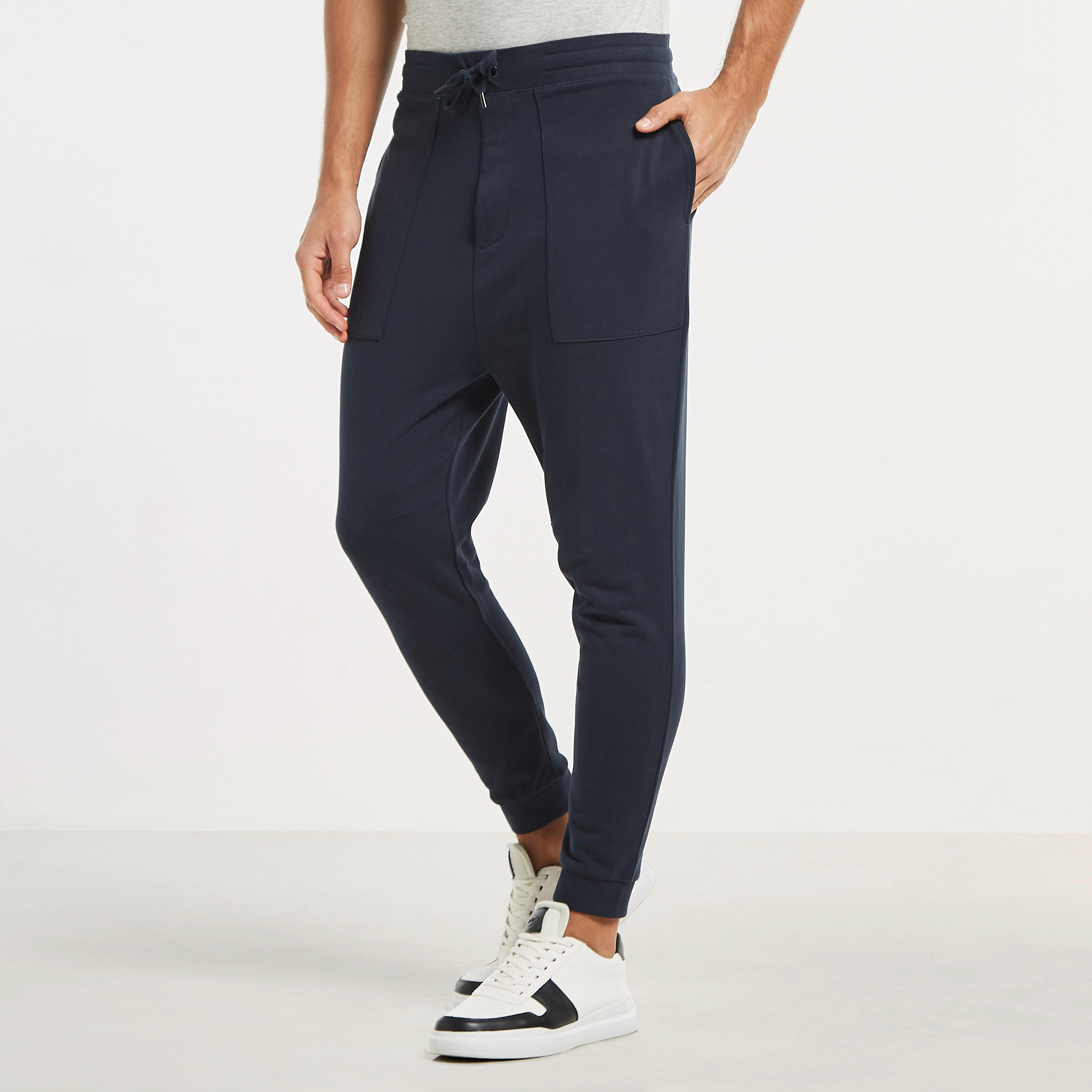 بنطلون رياضي سادة بخصر مطاطي وجيوب فضفاض-men-clothing-bottoms-joggers-image-13