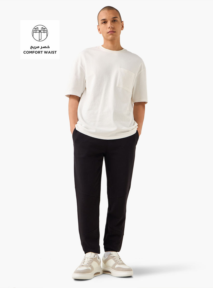 بنطلون رياضي بخصر مرن وتصميم بألواح وجيوب-men-clothing-bottoms-joggers-image-2