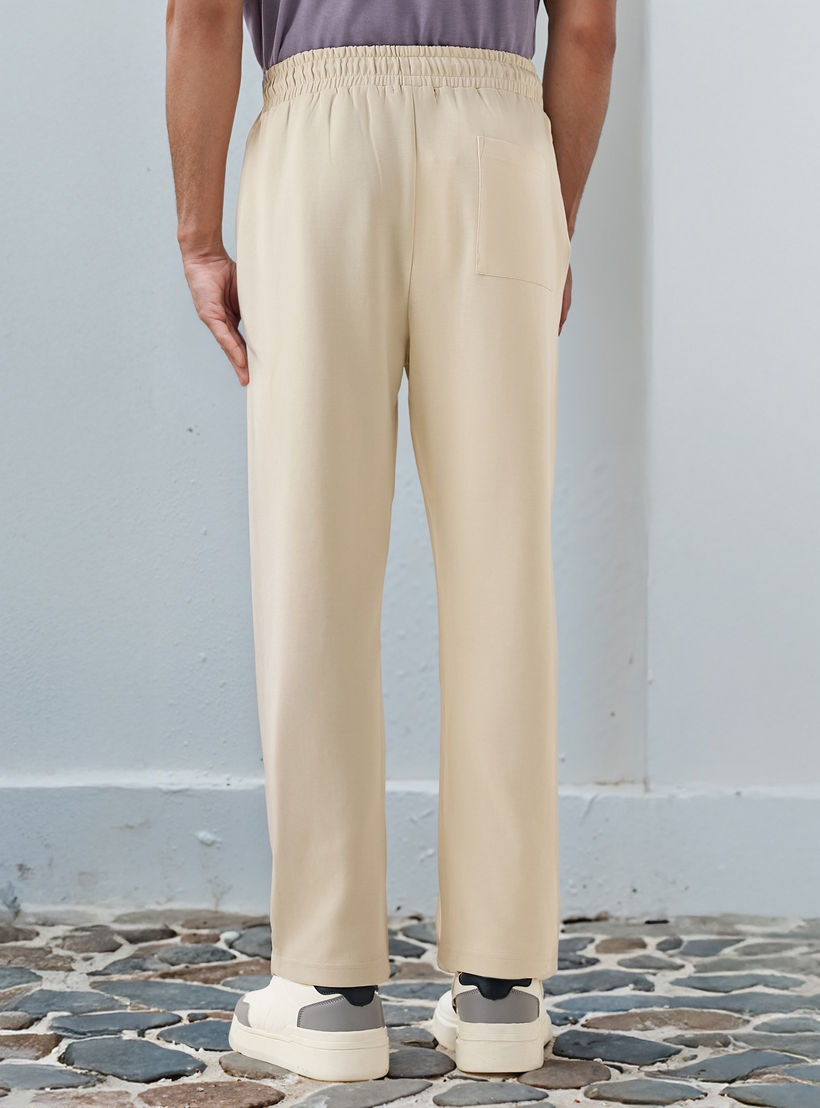 بنطلون رياضي بقصّة مريحة وخصر مطاطي وجيوب-men-clothing-bottoms-joggers-image-3