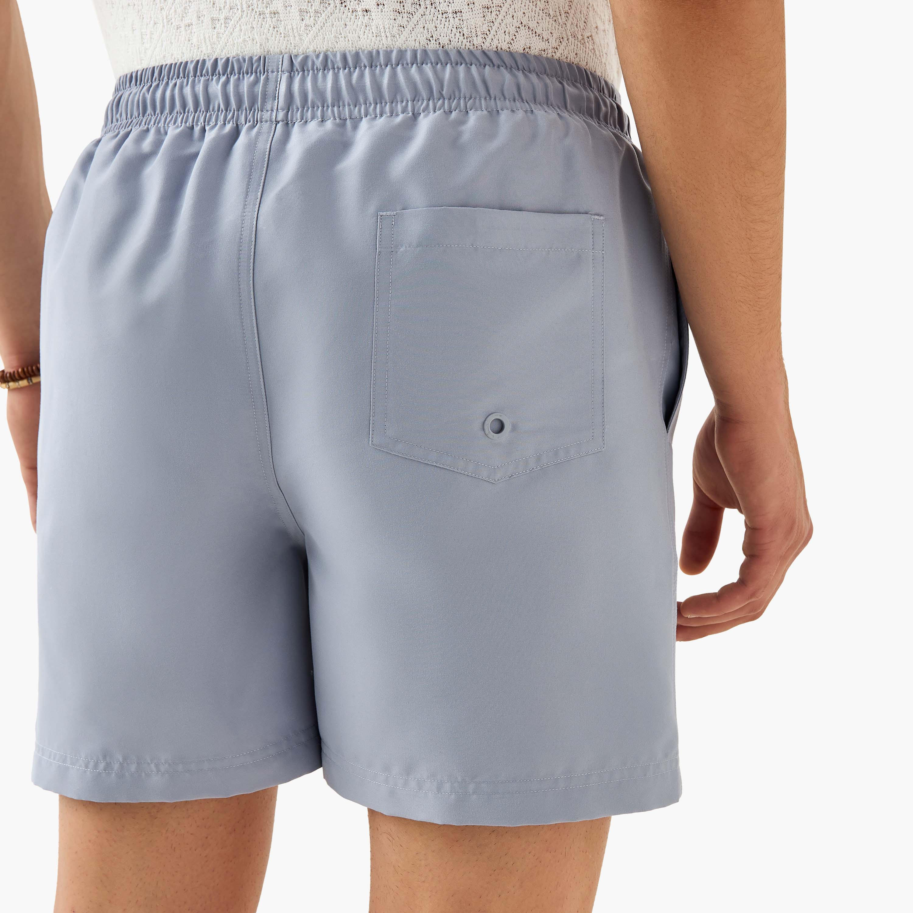 شورت سباحة بخصر مطاطي وجيوب-sports-men-clothing-swimwear-image-2
