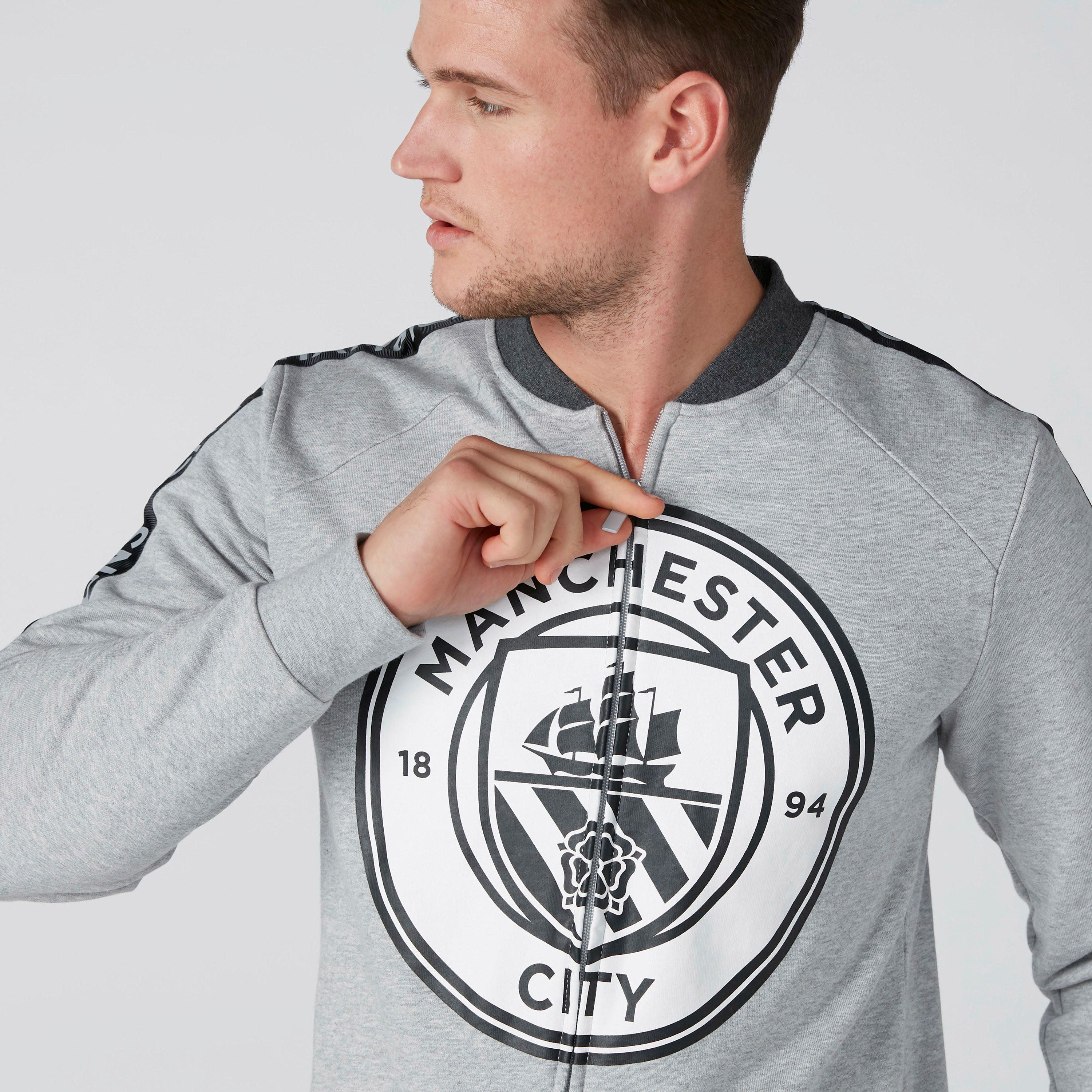 جاكيت بسحّاب إغلاق وجيوب وطبعات مانشستر سيتي-men-clothing-jacketsandblazers-jackets-image-5