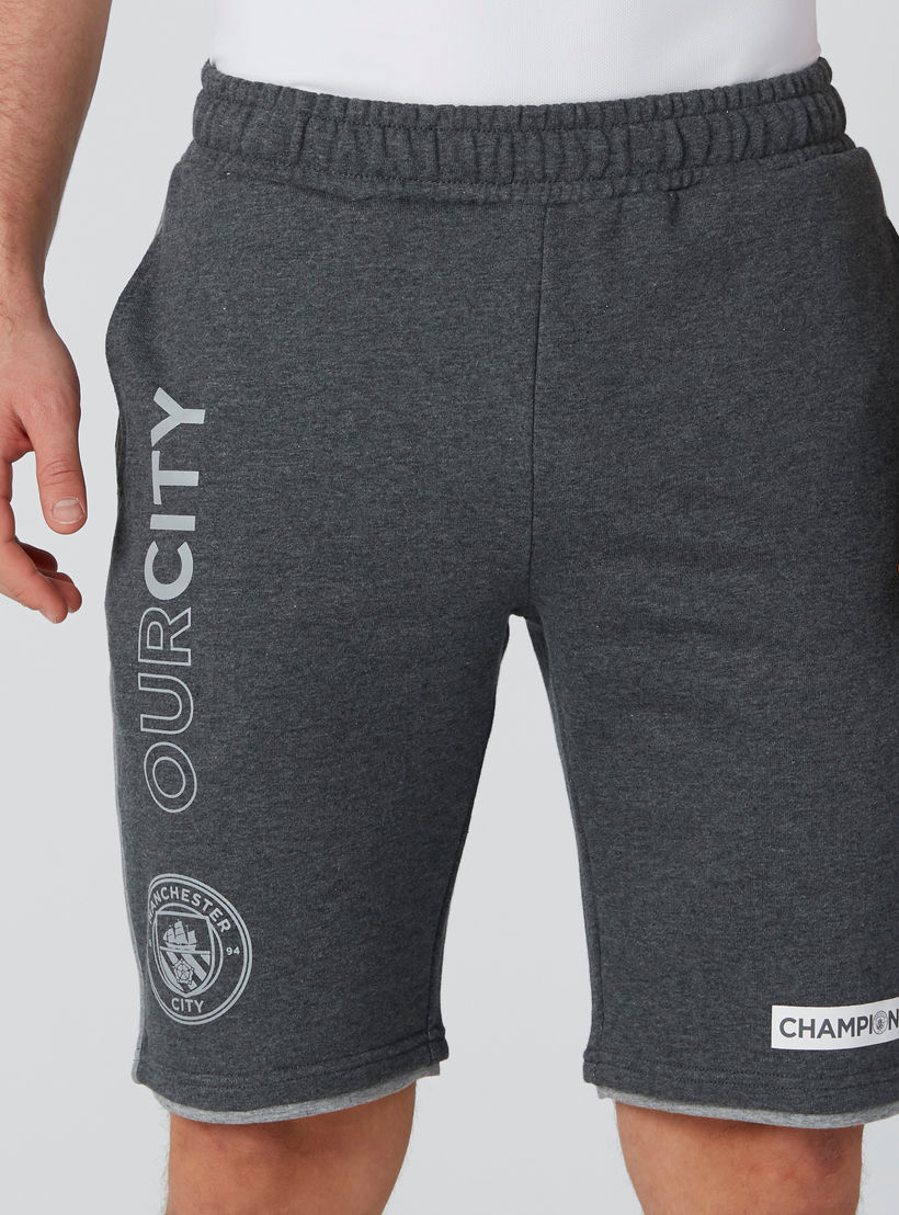 شورت بخصر مطّاطي وجيوب وطبعات-men-clothing-sportswearandactivewear-bottoms-image-5
