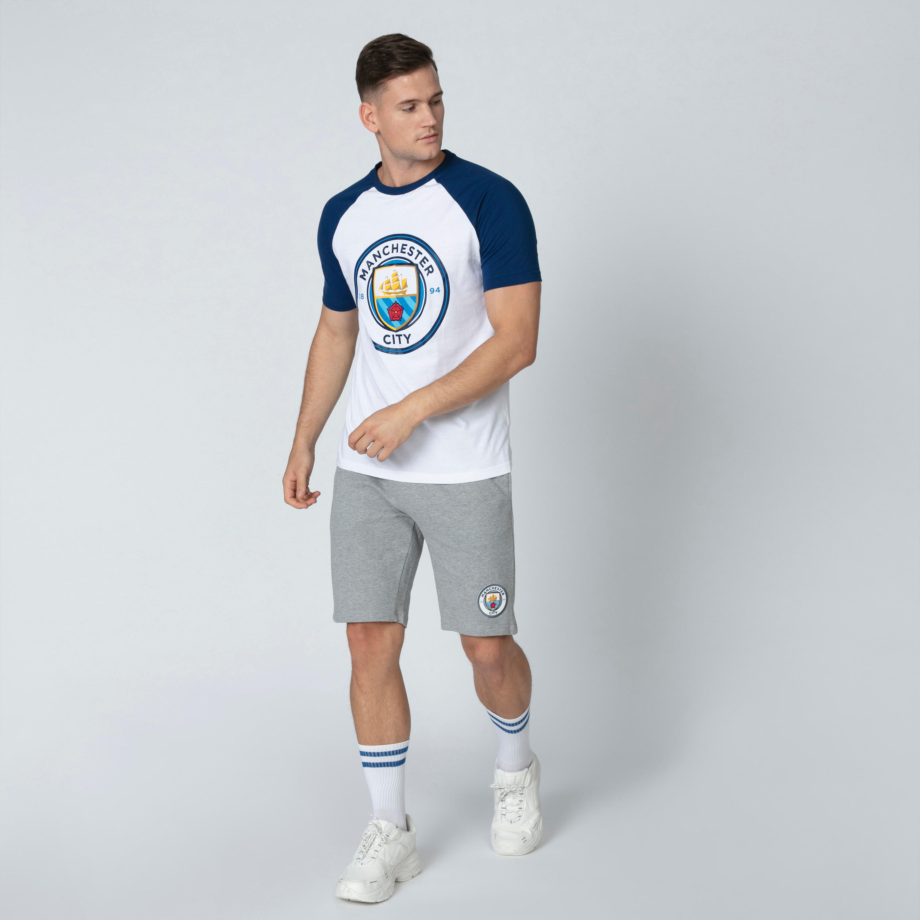 تيشيرت بياقة مستديرة وأكمام مغايرة وطبعات مانشستر سيتي-men-clothing-sportswearandactivewear-tshirtsandpolos-image-1