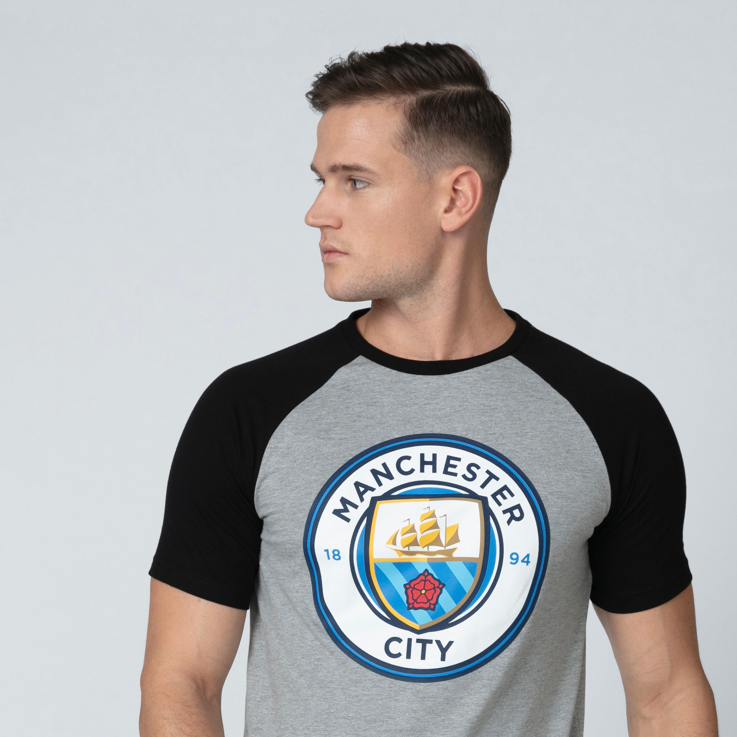 تيشيرت بياقة مستديرة وأكمام مغايرة وطبعات مانشستر سيتي-men-clothing-sportswearandactivewear-tshirtsandpolos-image-1