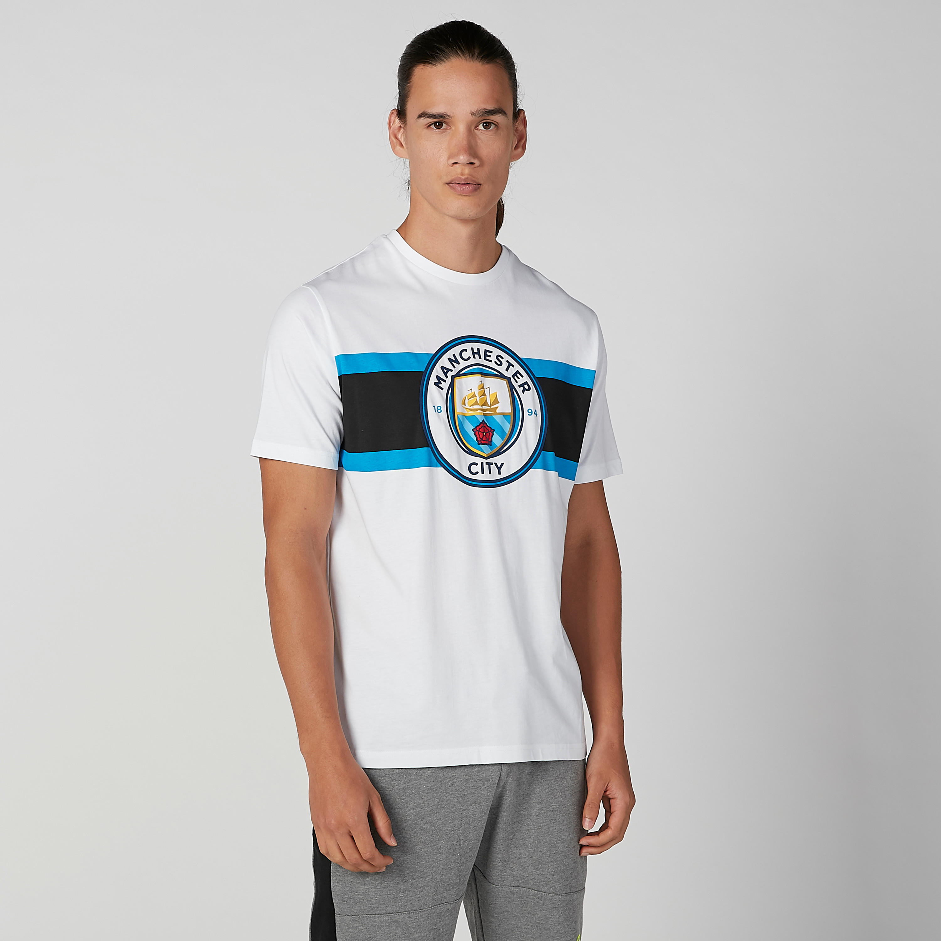 تيشيرت بياقة ضيّقة وأكمام قصيرة وطبعات مانشستر سيتي-men-clothing-sportswearandactivewear-tshirtsandpolos-image-1