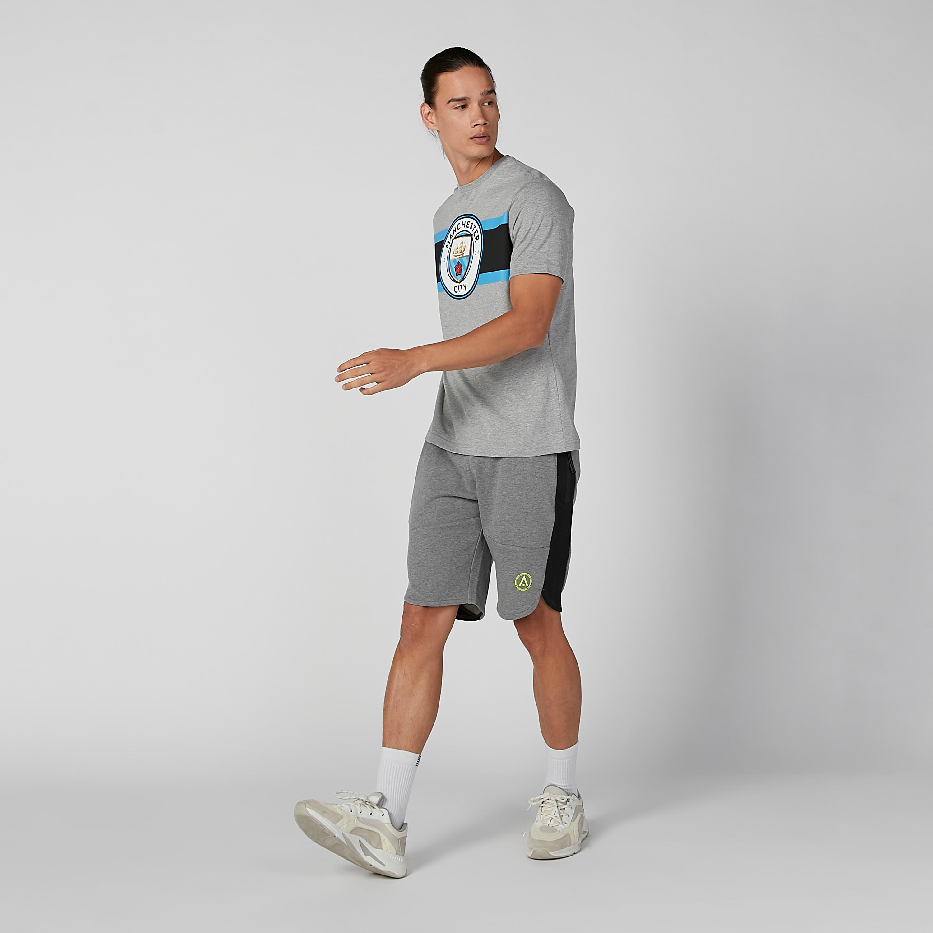 تيشيرت بياقة ضيّقة وأكمام قصيرة وطبعات مانشستر سيتي-men-clothing-sportswearandactivewear-tshirtsandpolos-image-4