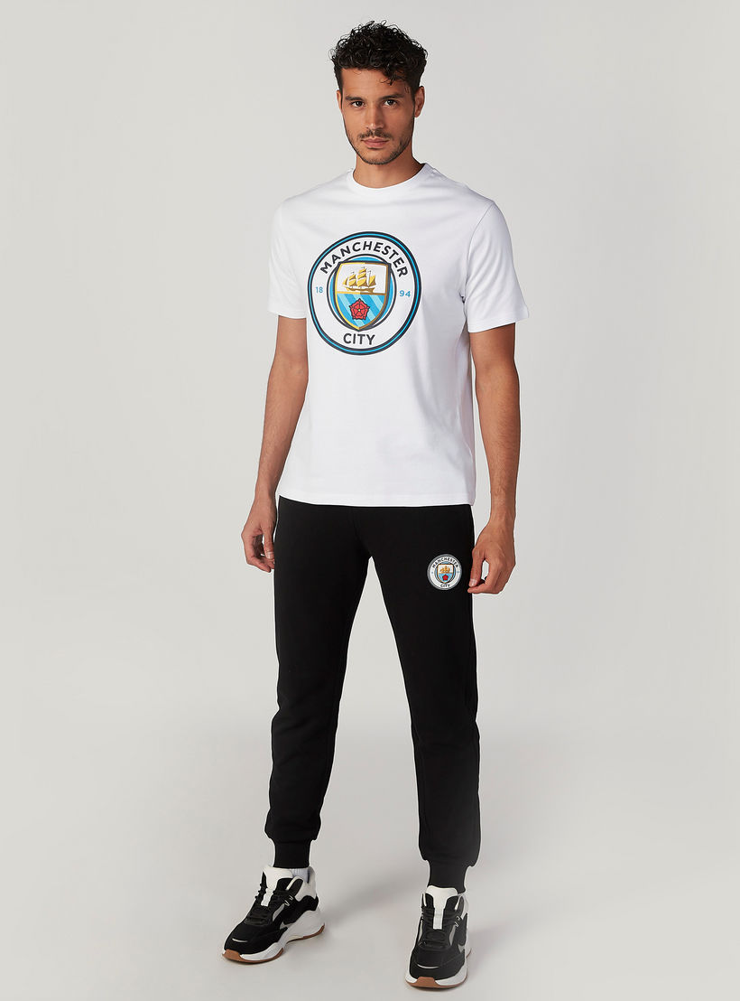 بنطلون رياضي سادة بخصر مطّاطي وجيوب-men-clothing-sportswearandactivewear-bottoms-image-3
