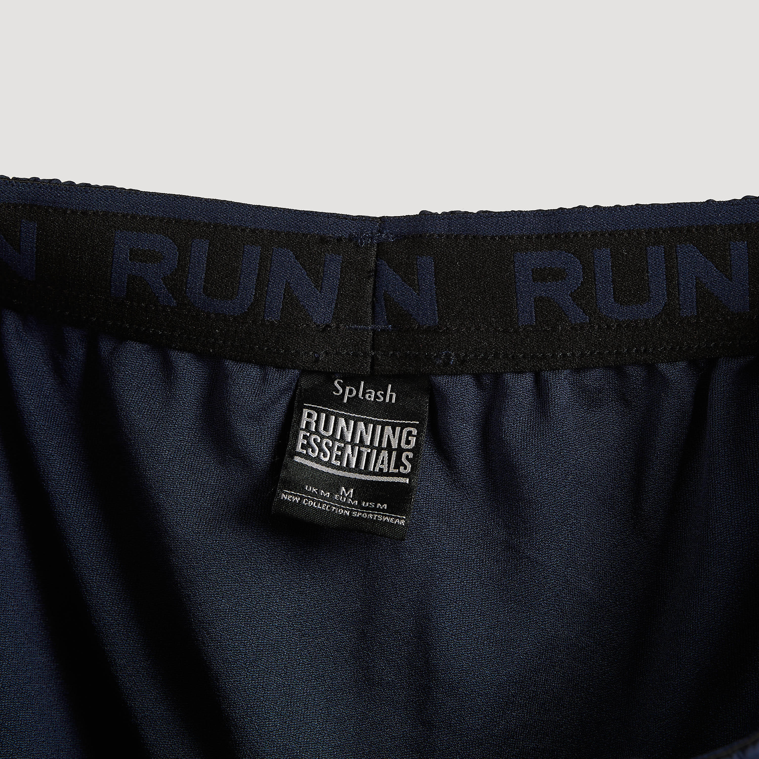 شورت سادة بخصر مطاطي وجيوب-men-clothing-sportswearandactivewear-bottoms-image-1