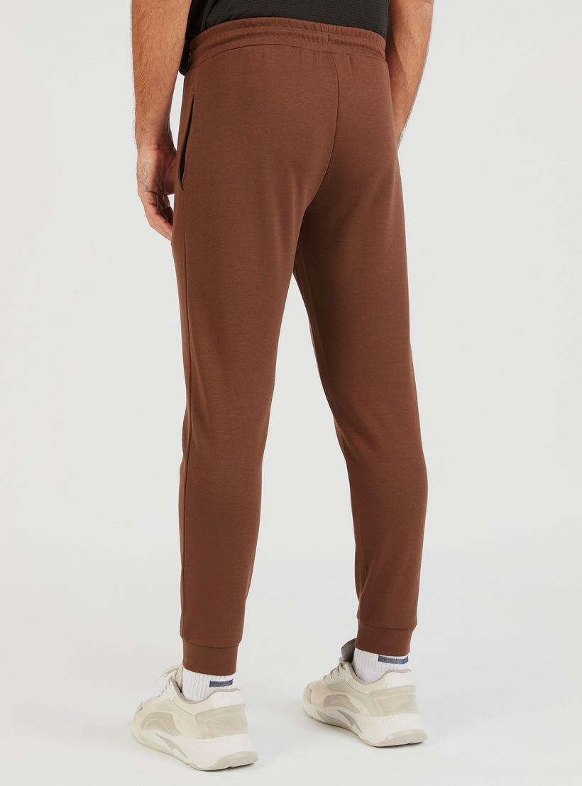Solid Joggers with Drawstring Closure and Pockets-men-clothing-sportswearandactivewear-bottoms-image-4