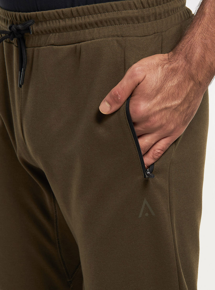 بنطلون رياضي سادة برباط إغلاق وجيوب بسحّاب-men-clothing-sportswearandactivewear-bottoms-image-1
