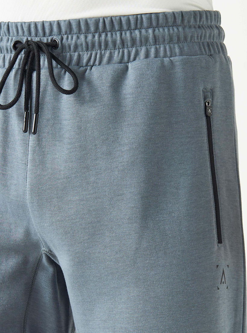 بنطلون رياضي سادة برباط إغلاق وجيوب-men-clothing-sportswearandactivewear-bottoms-image-1