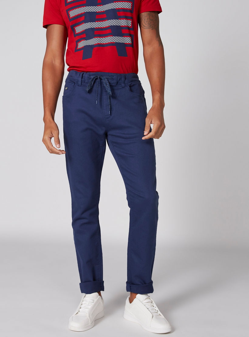 بنطال طويل من الدينم بخصر مطّاطي وجيوب-men-clothing-bottoms-jeans-image-1
