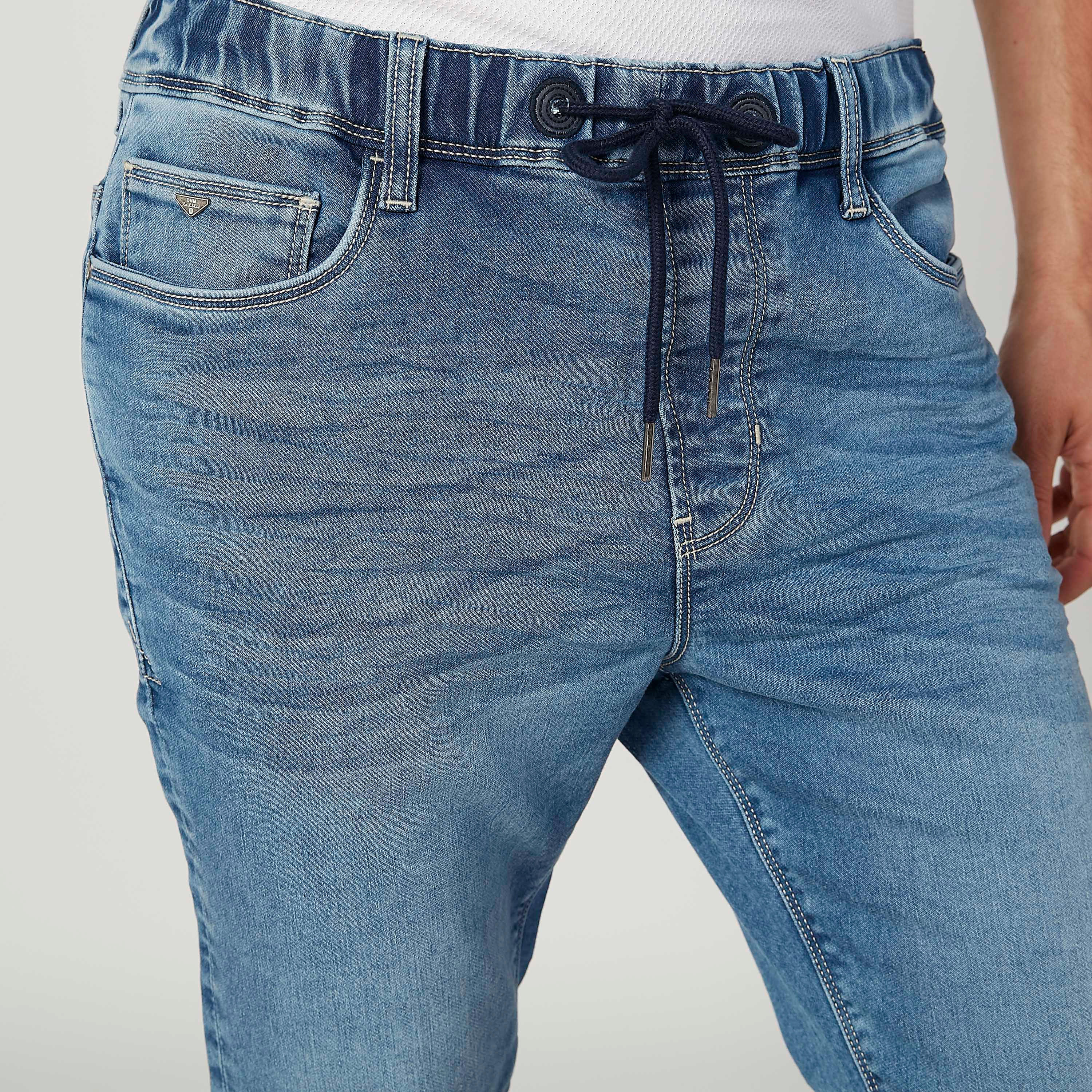 بنطلون جينز مستدام سكيني بارز الملمس بخصر منخفض وجيوب-men-clothing-bottoms-jeans-image-3
