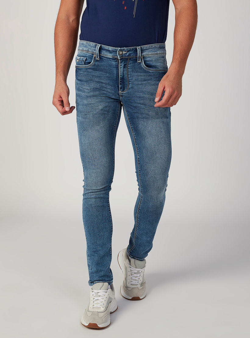 بنطلون جينز مستدام سكيني سادة بخصر منخفض وجيوب -men-clothing-bottoms-jeans-image-1