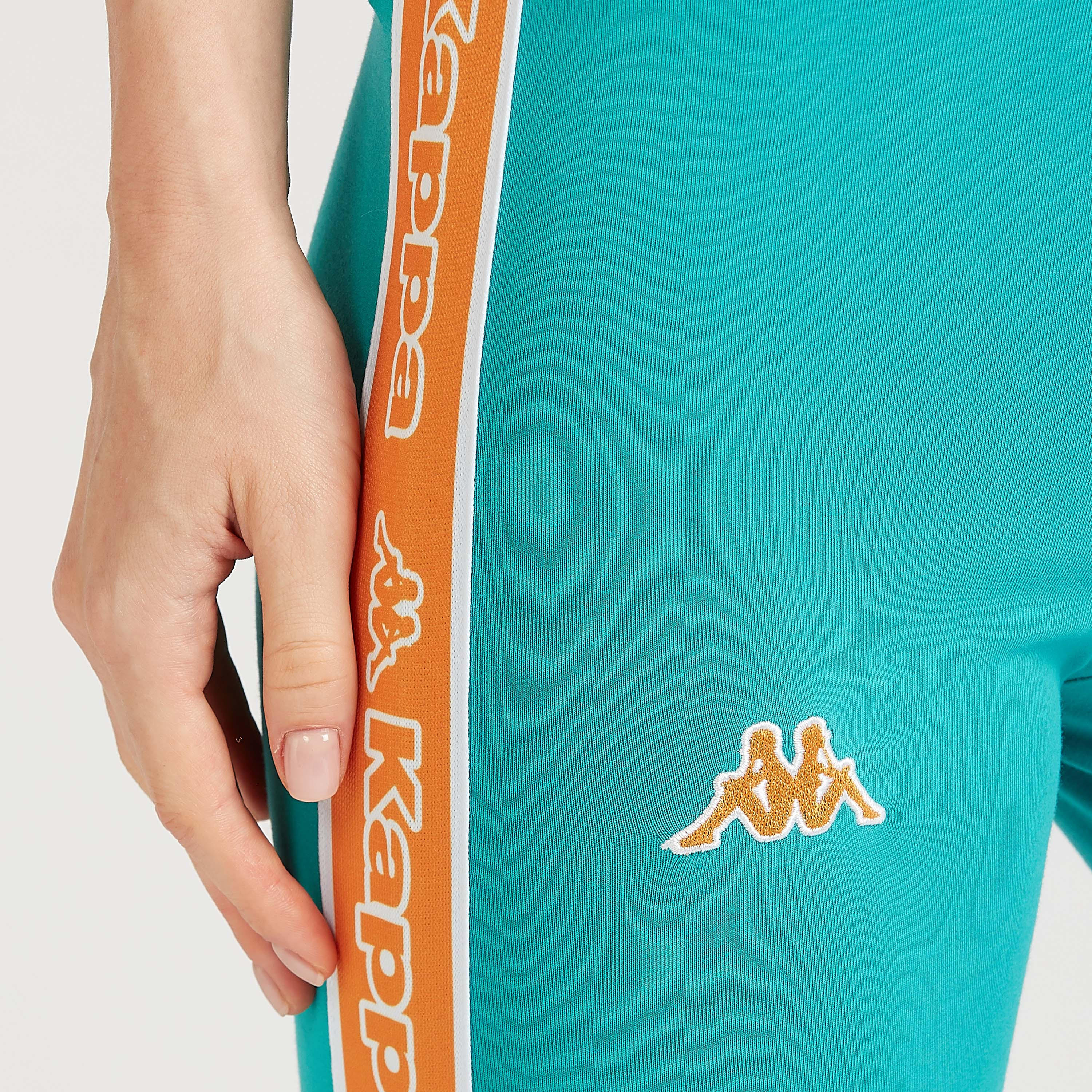 بنطلون ليقنز سادة بخصر مطّاطي وتفاصيل شريطة-women-clothing-sportswearandactivewear-bottoms-image-3