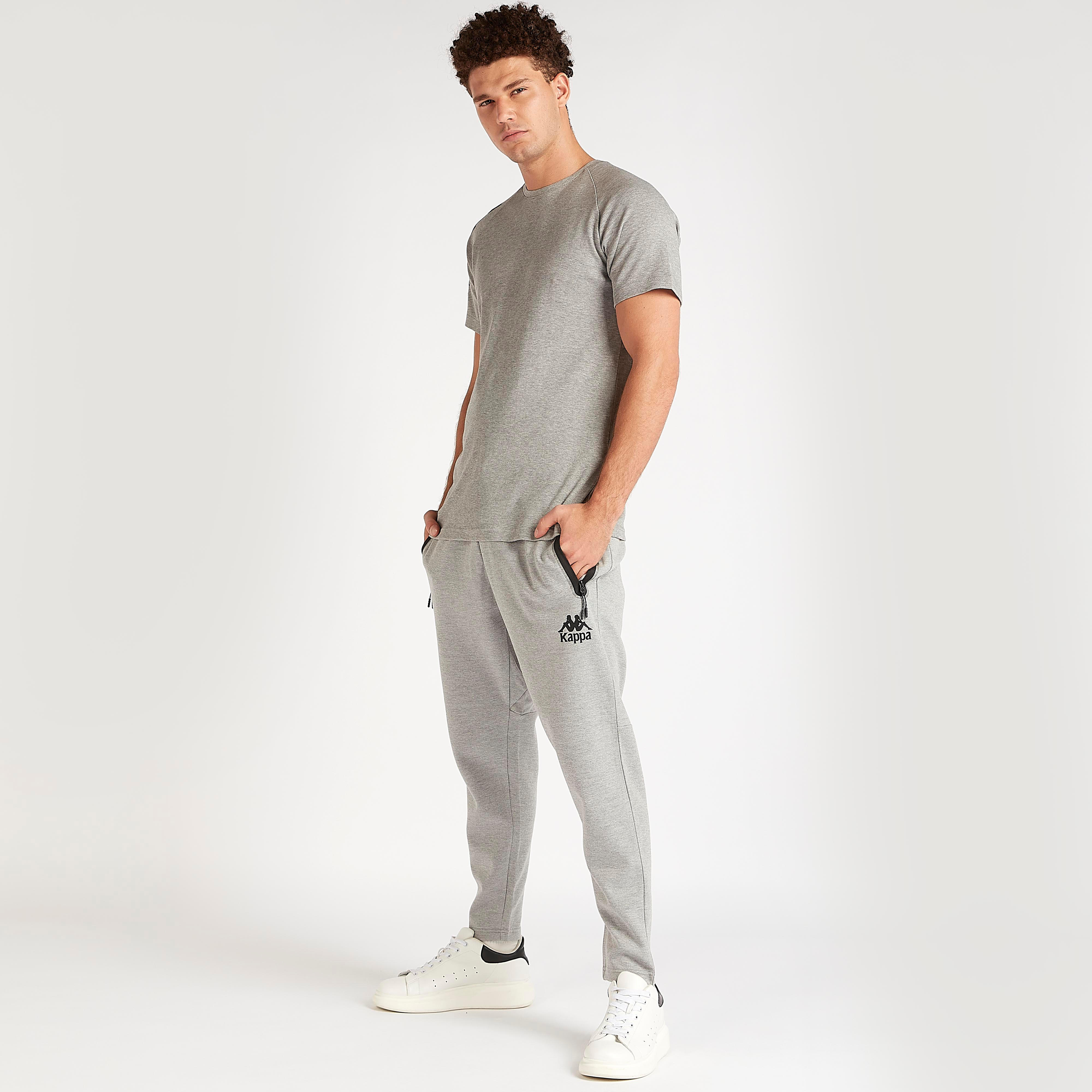 بنطلون رياضي سادة بخصر مطّاطي وجيوب من كابا-men-clothing-sportswearandactivewear-tracksuits-image-3