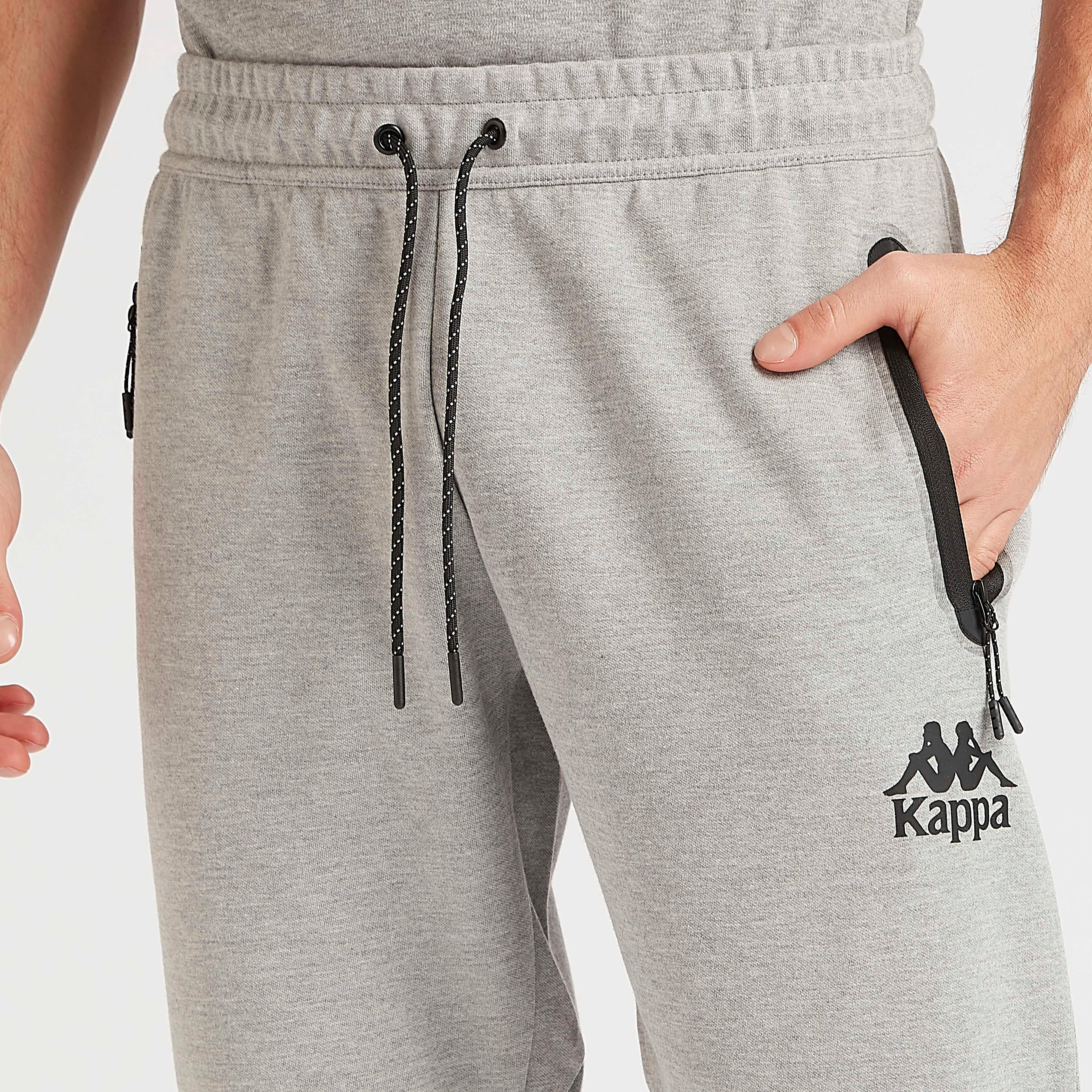 بنطلون رياضي سادة بخصر مطّاطي وجيوب من كابا-men-clothing-sportswearandactivewear-tracksuits-image-2
